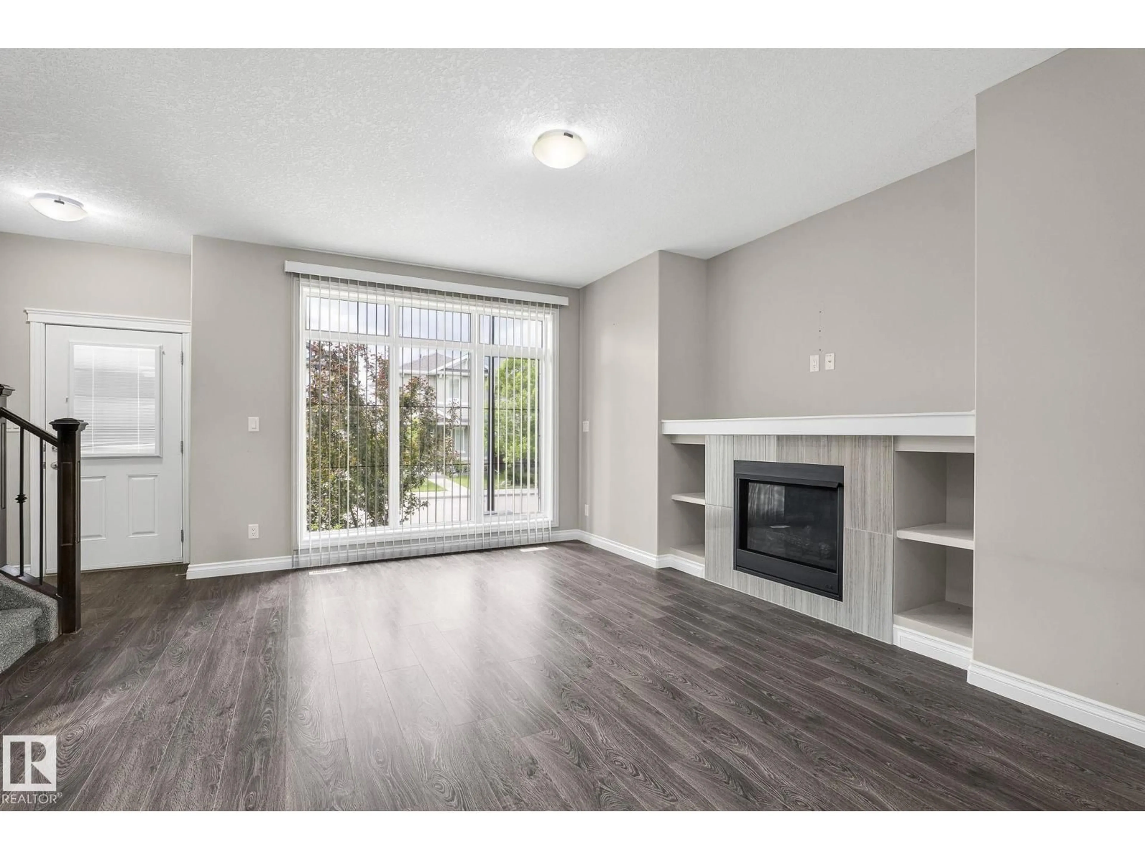 Living room with furniture, wood/laminate floor for SW - 6927 CARDINAL WYND, Edmonton Alberta T6W2Y3