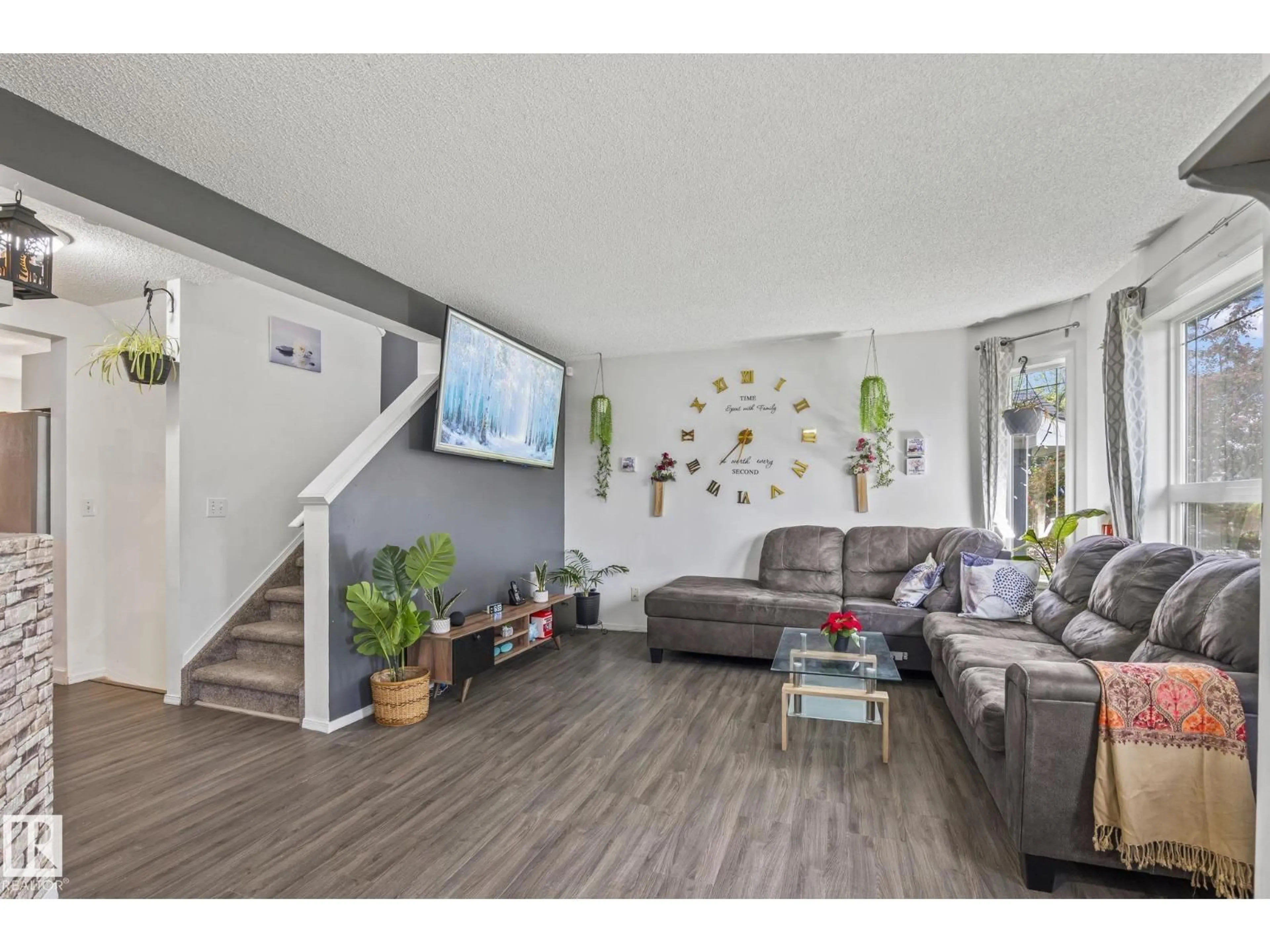 Living room with furniture, wood/laminate floor for 128 BROOKVIEW WY, Stony Plain Alberta T7Z2X6