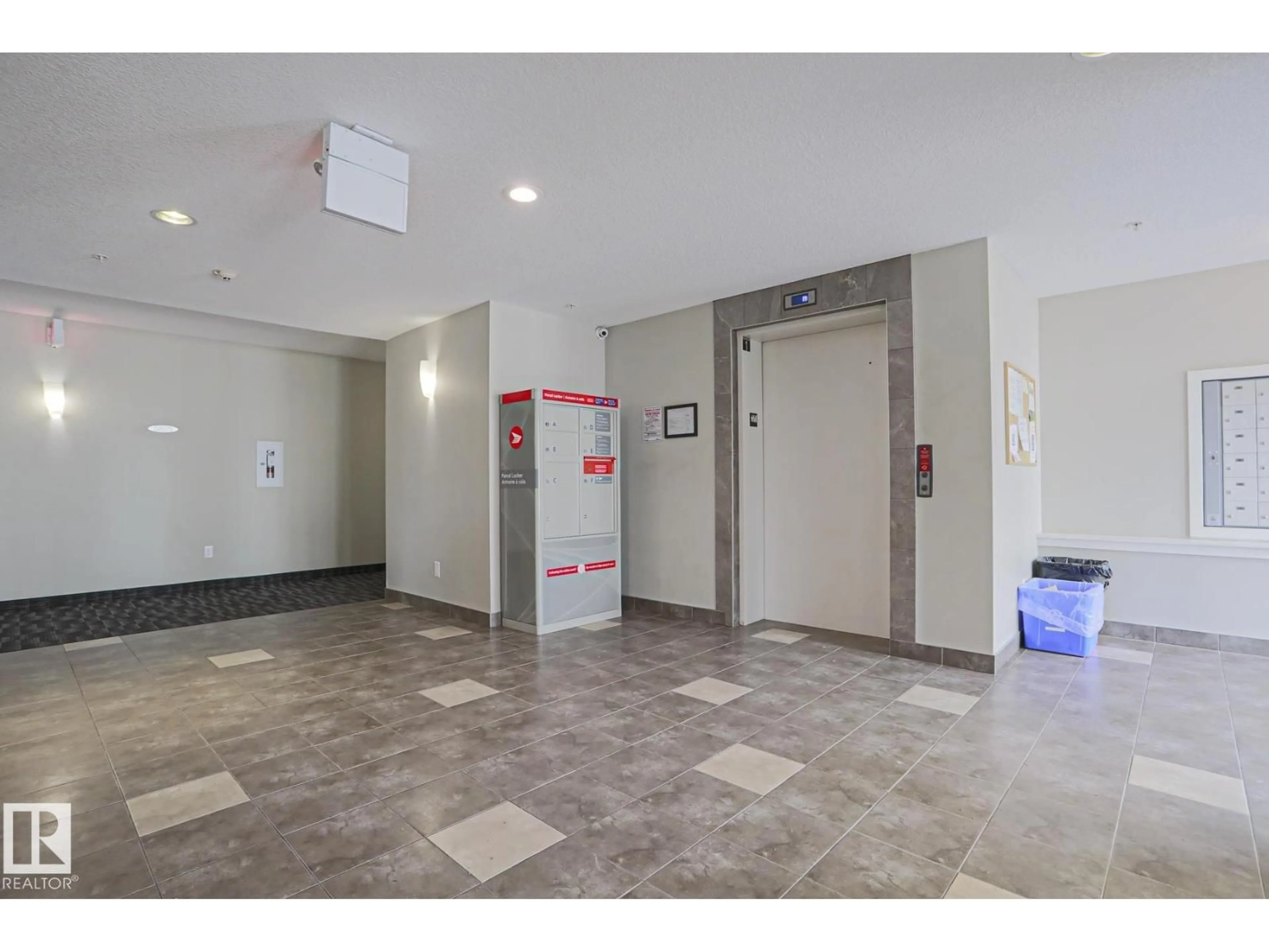 Indoor foyer for #411 - 3353 16A AV, Edmonton Alberta T6T0V4