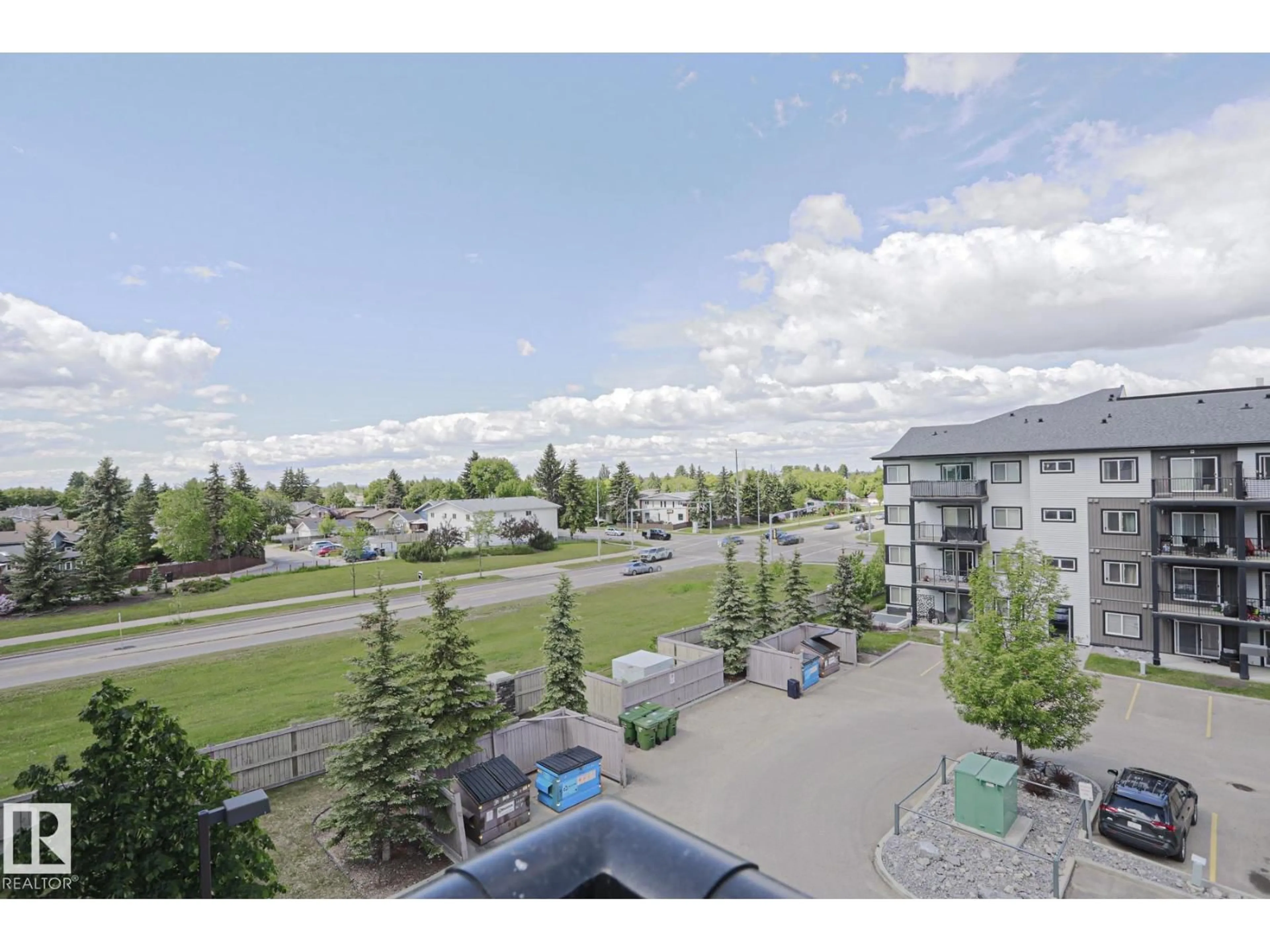 A pic from outside/outdoor area/front of a property/back of a property/a pic from drone, mountain view for #411 - 3353 16A AV, Edmonton Alberta T6T0V4