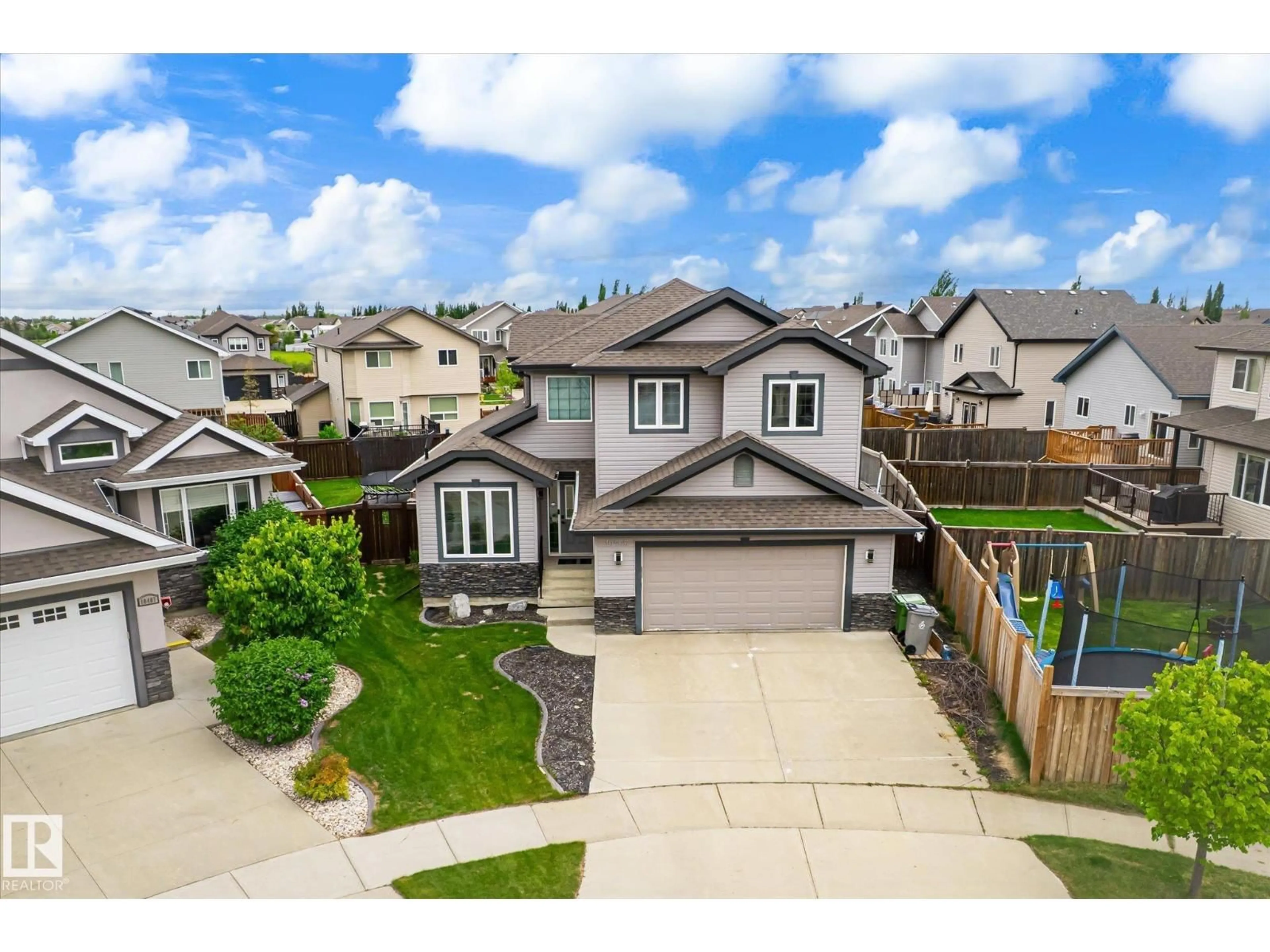 A pic from outside/outdoor area/front of a property/back of a property/a pic from drone, street for 10405 98 ST, Morinville Alberta T8R0B7