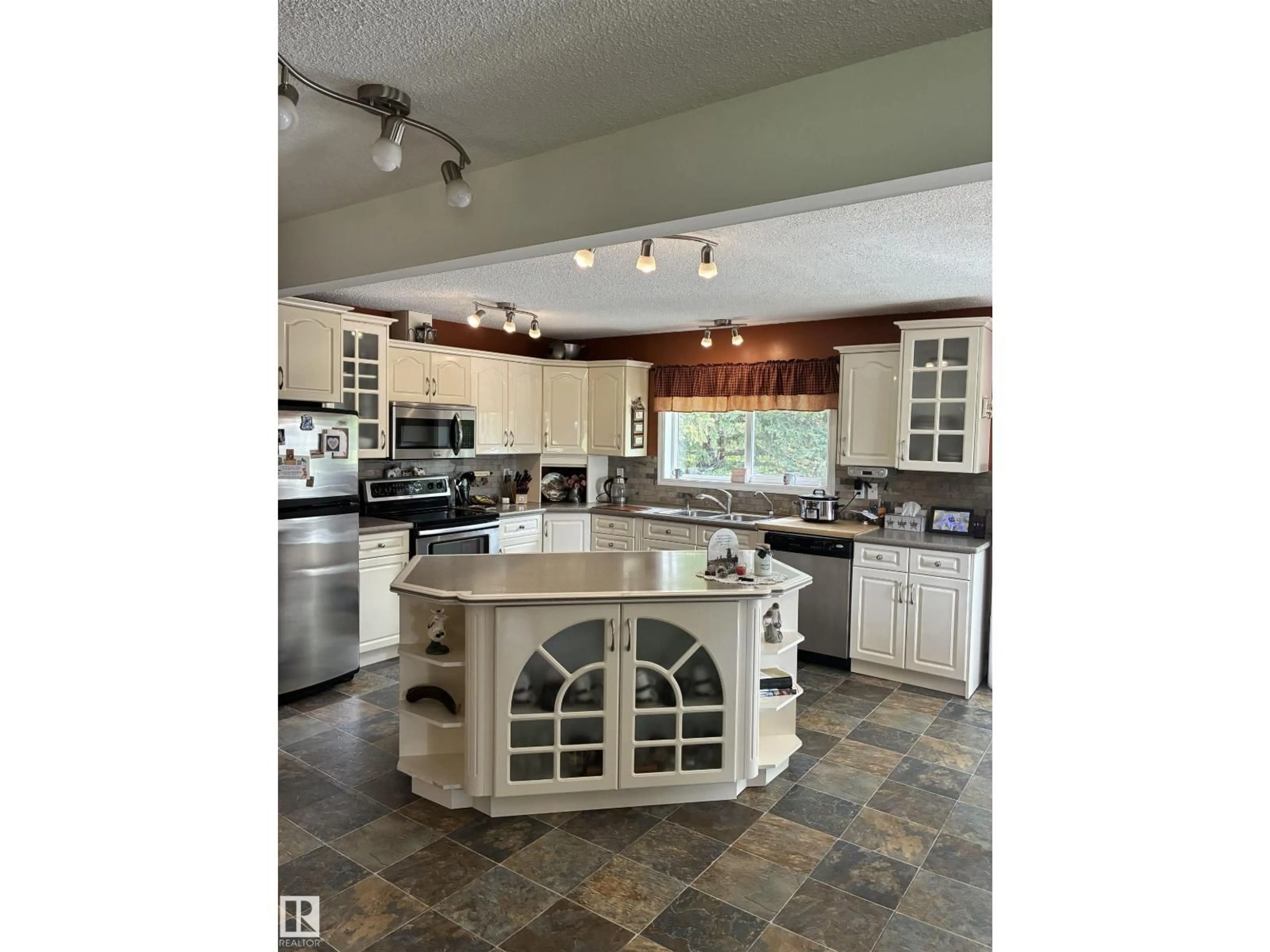 Open concept kitchen, ceramic/tile floor for 25055 TWP RD 492, Rural Leduc County Alberta T4X2M6