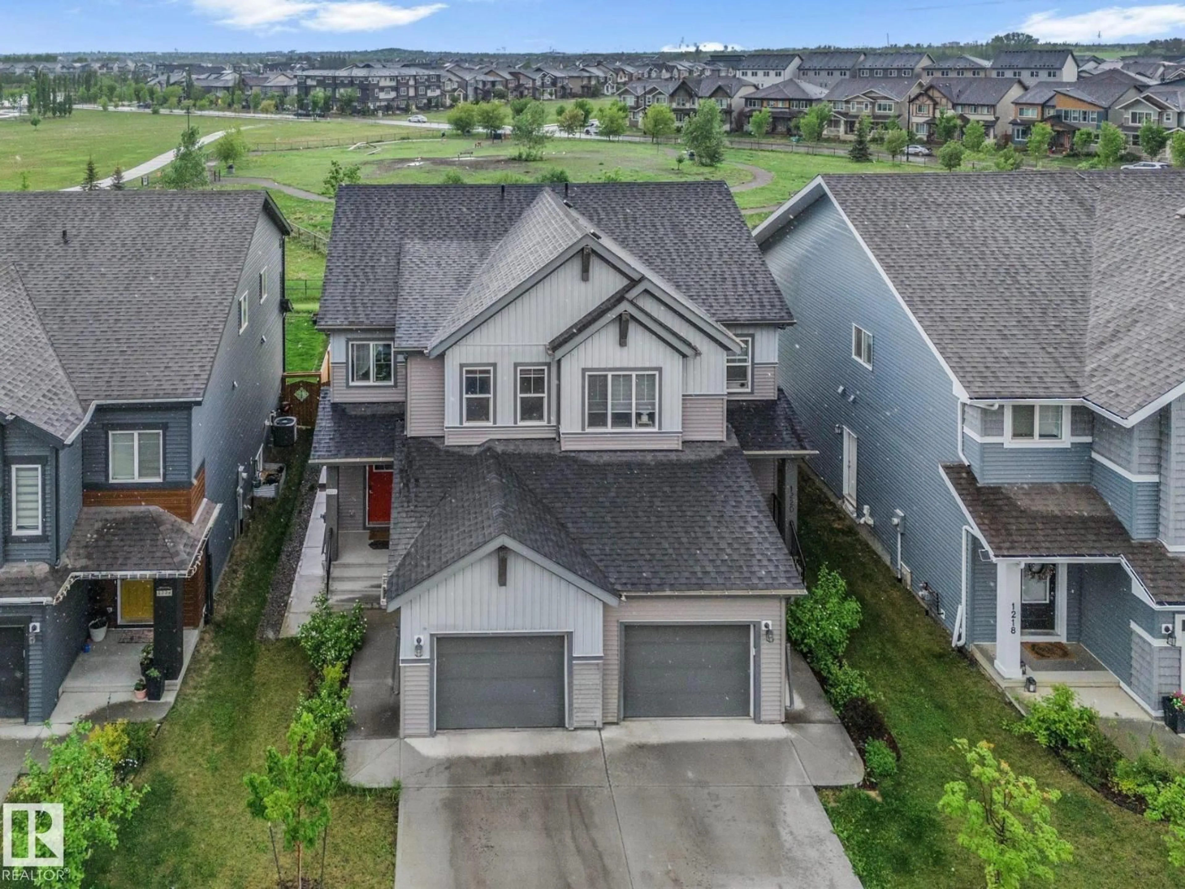 A pic from outside/outdoor area/front of a property/back of a property/a pic from drone, mountain view for SW - 1222 PODERSKY WD, Edmonton Alberta T6W4W3