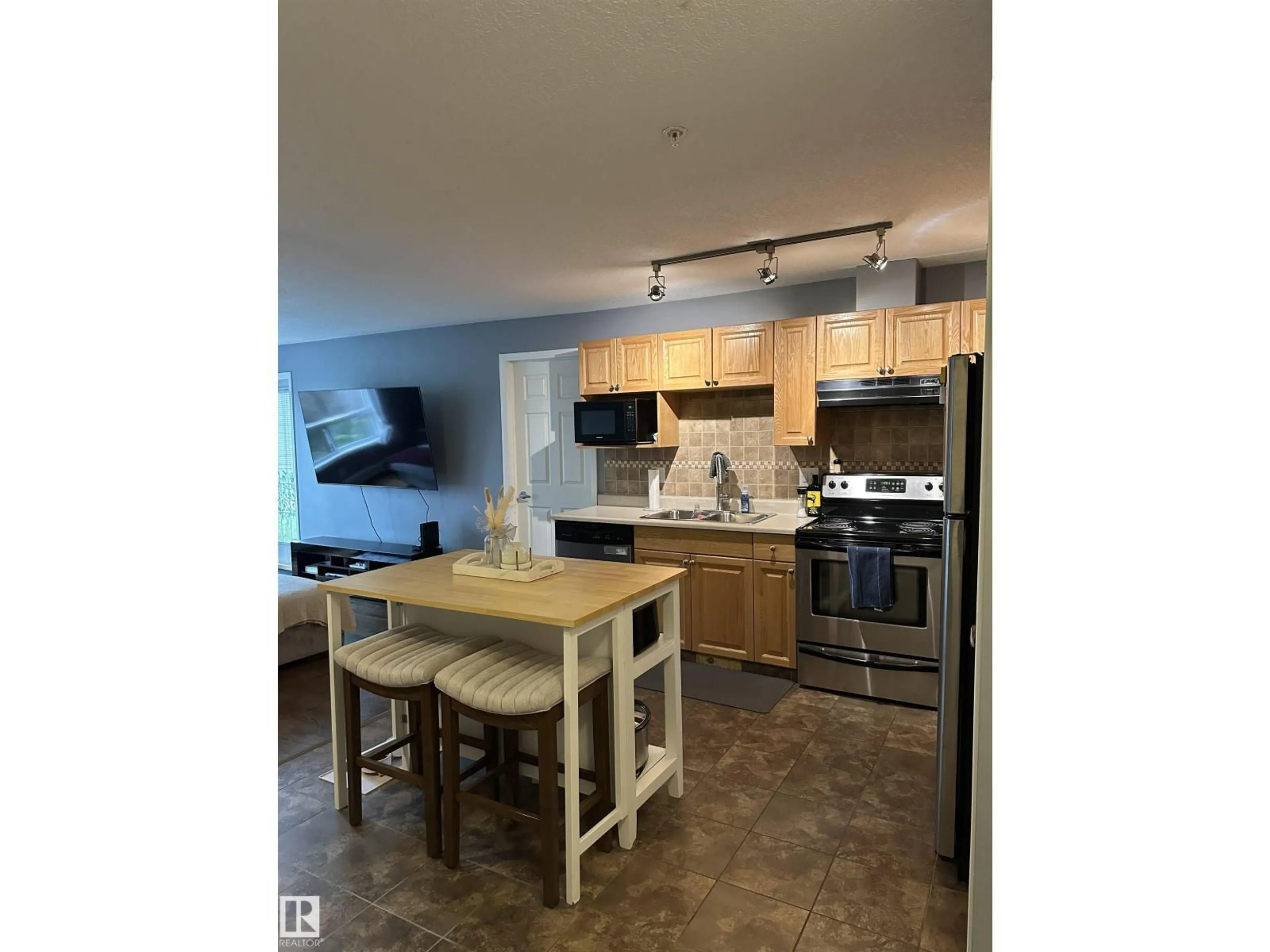 Open concept kitchen, unknown for #116 - 5005 165 AV, Edmonton Alberta T5Y0L8