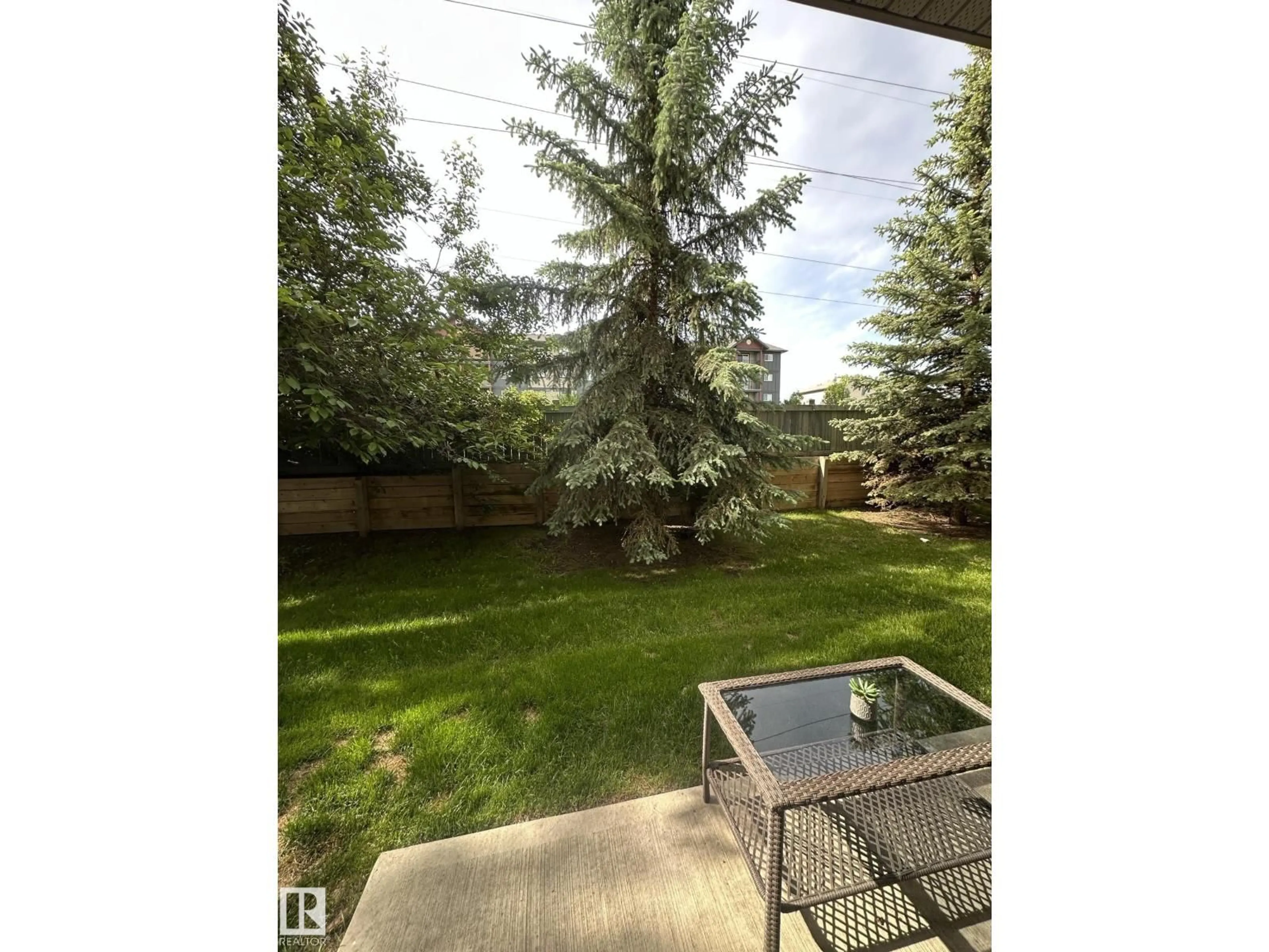 Patio, forest/trees view for #116 - 5005 165 AV, Edmonton Alberta T5Y0L8