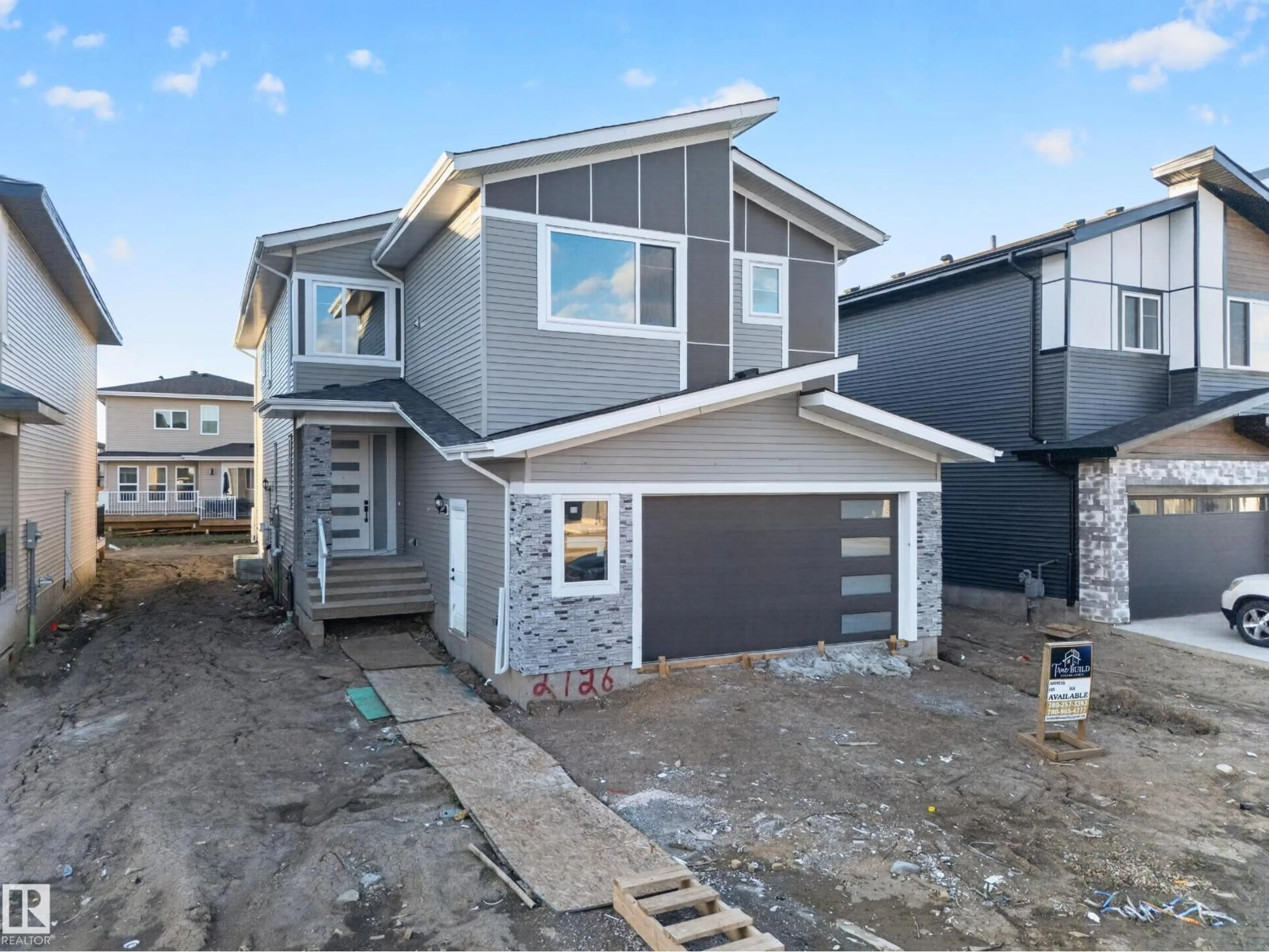 Home with vinyl exterior material, street for 2726 63AVE, Rural Leduc County Alberta T6X3A6