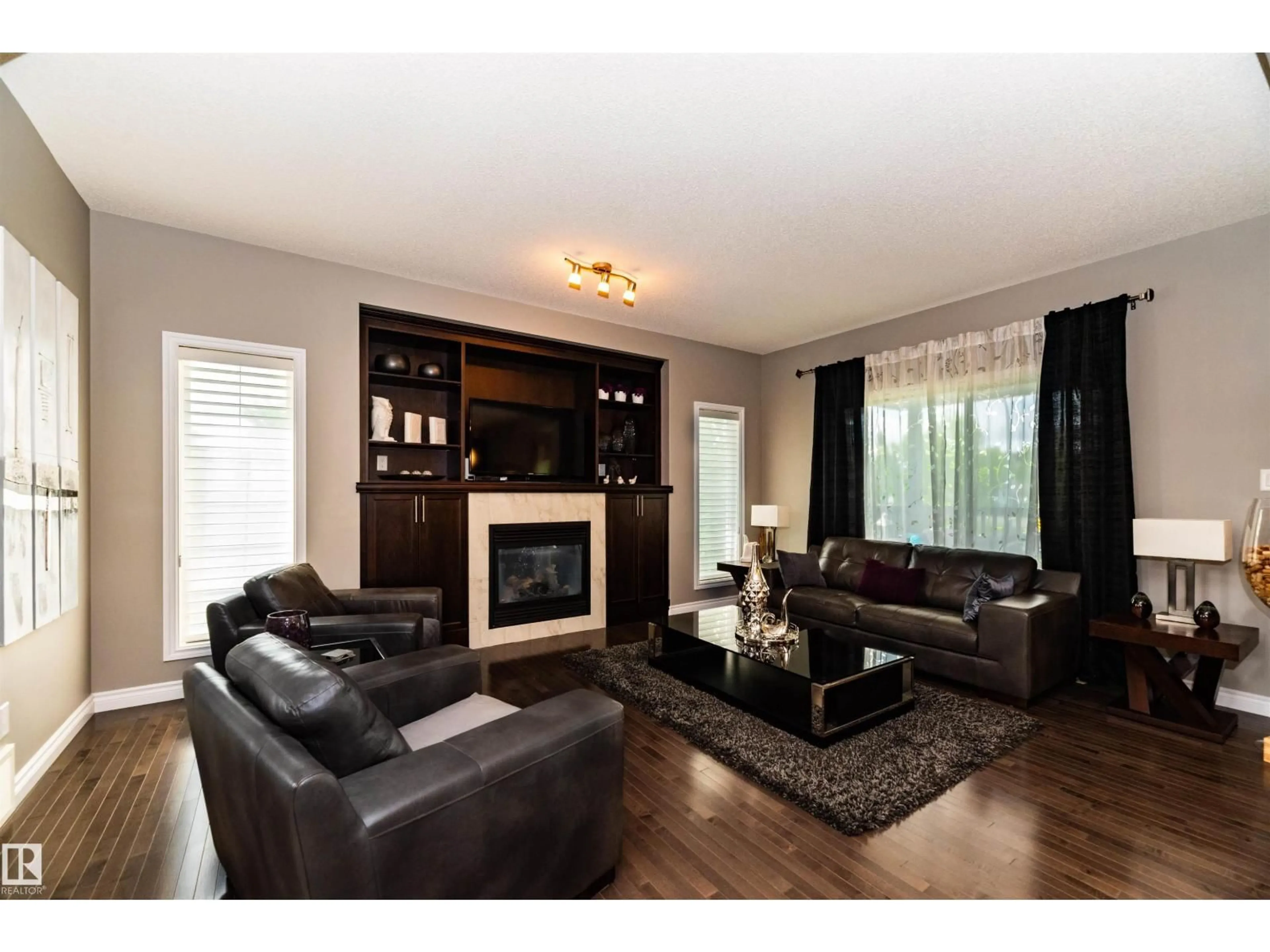Living room with furniture, wood/laminate floor for 504 CRANDELL CT, Sherwood Park Alberta T8H0H3