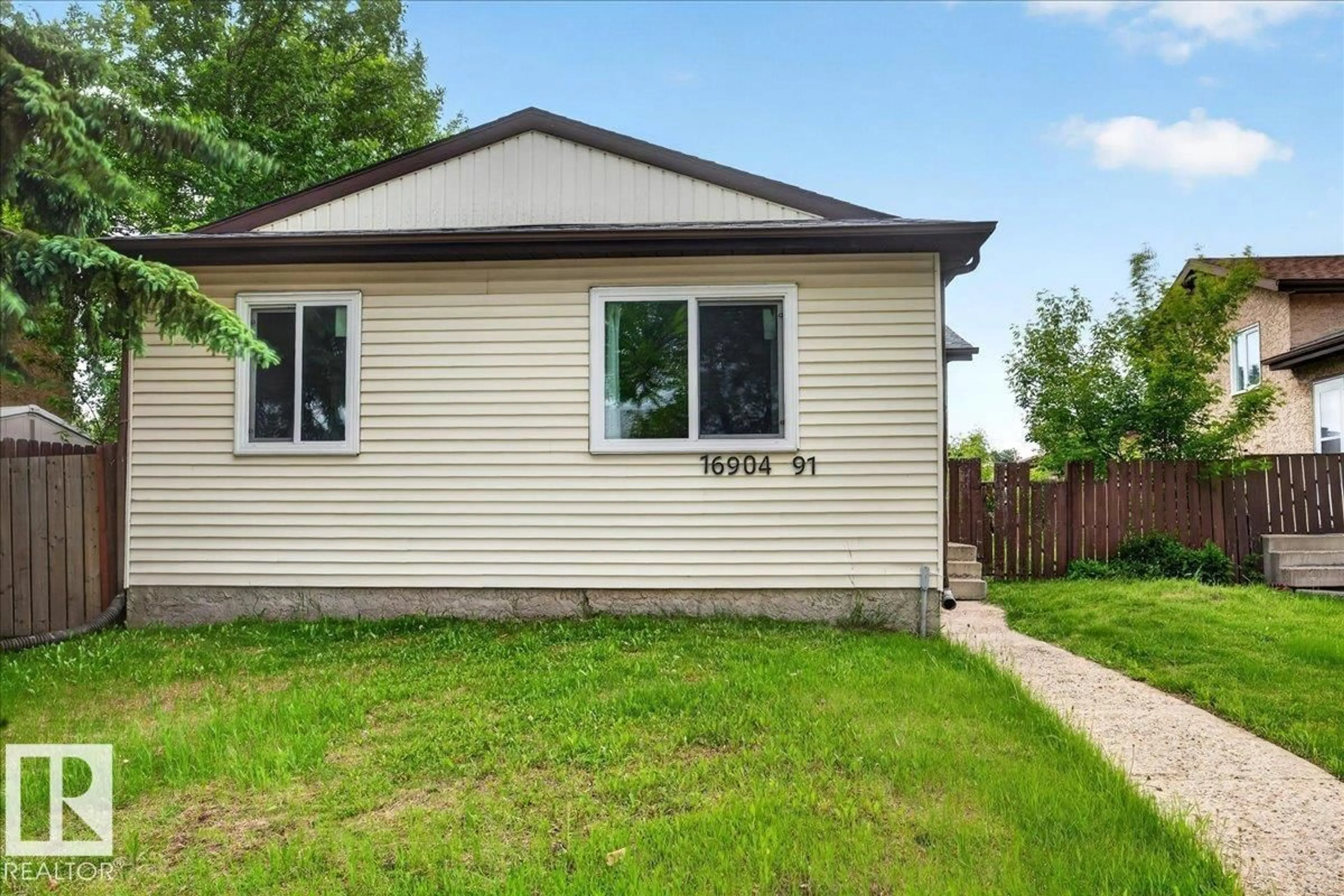 Home with vinyl exterior material, street for 16904 91 ST, Edmonton Alberta T5Z1W6
