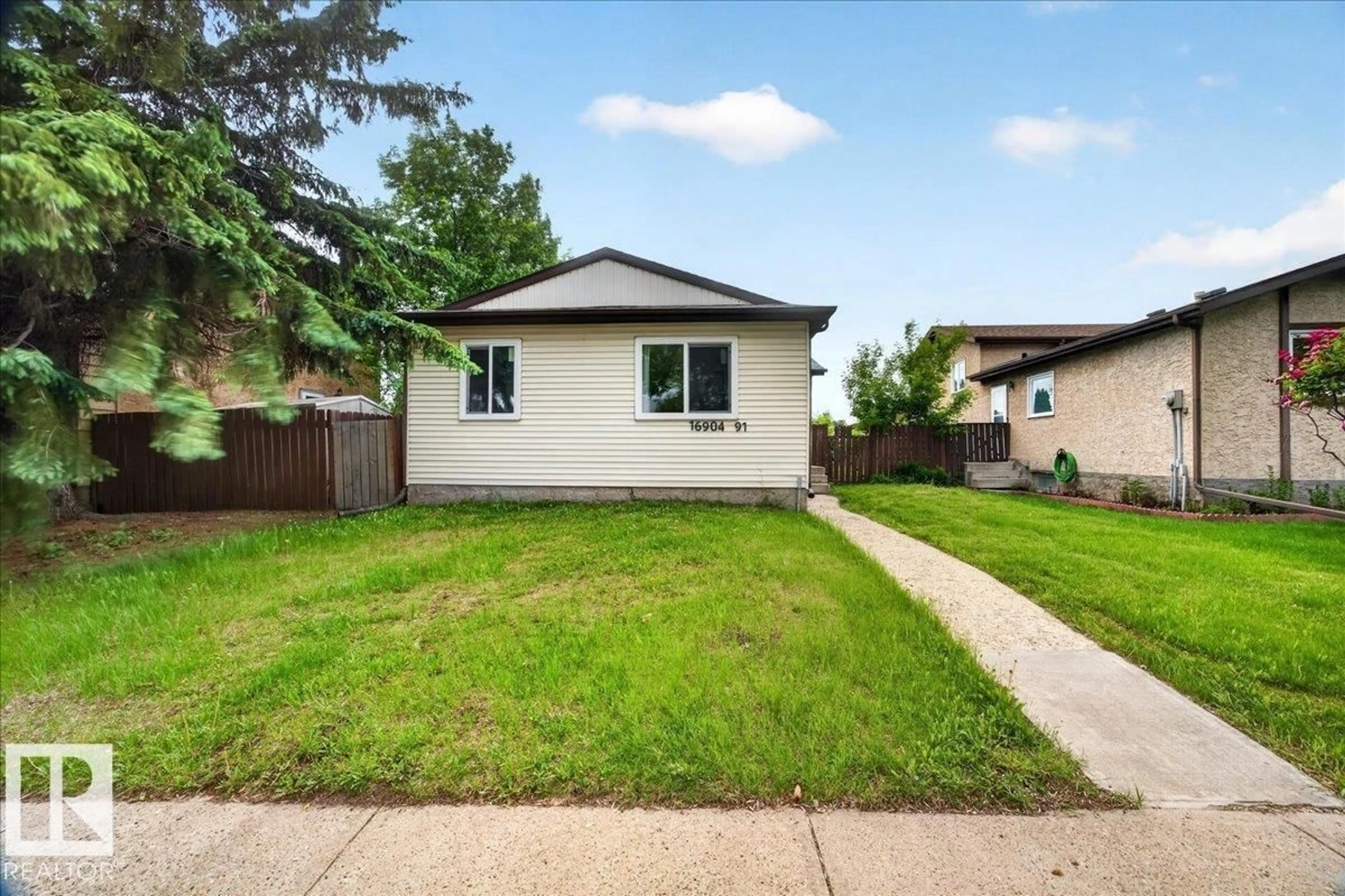 Home with vinyl exterior material, street for 16904 91 ST, Edmonton Alberta T5Z1W6