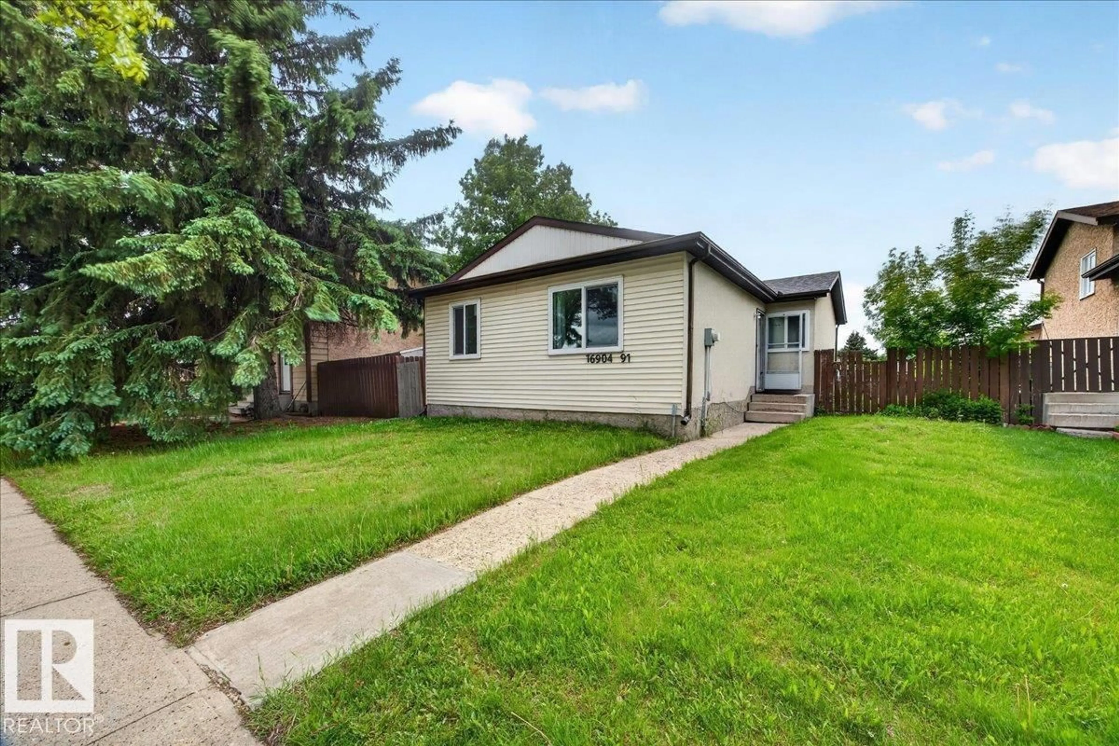 Home with vinyl exterior material, street for 16904 91 ST, Edmonton Alberta T5Z1W6
