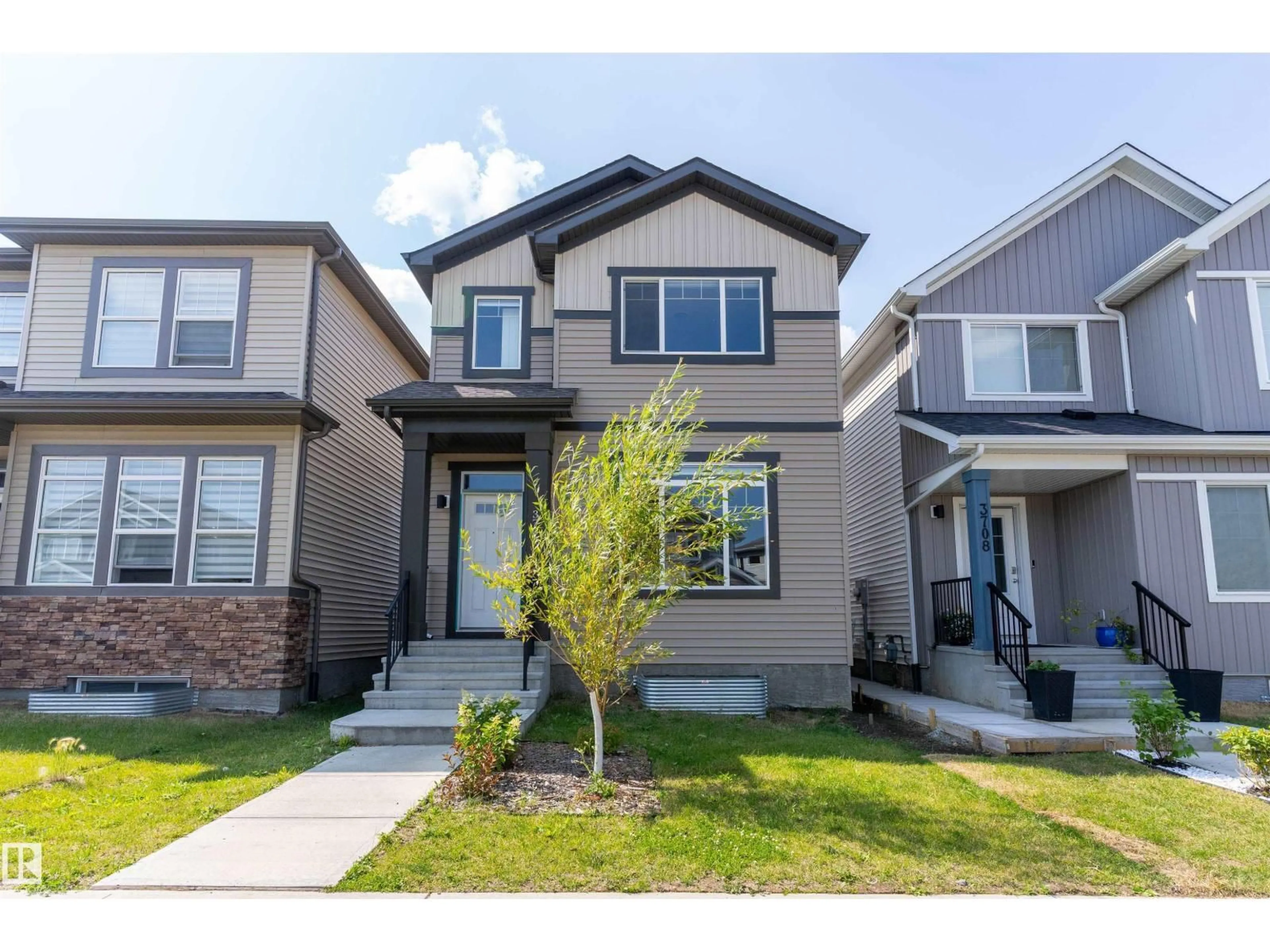 Home with vinyl exterior material, street for 3704 2 ST, Edmonton Alberta T6T2L8