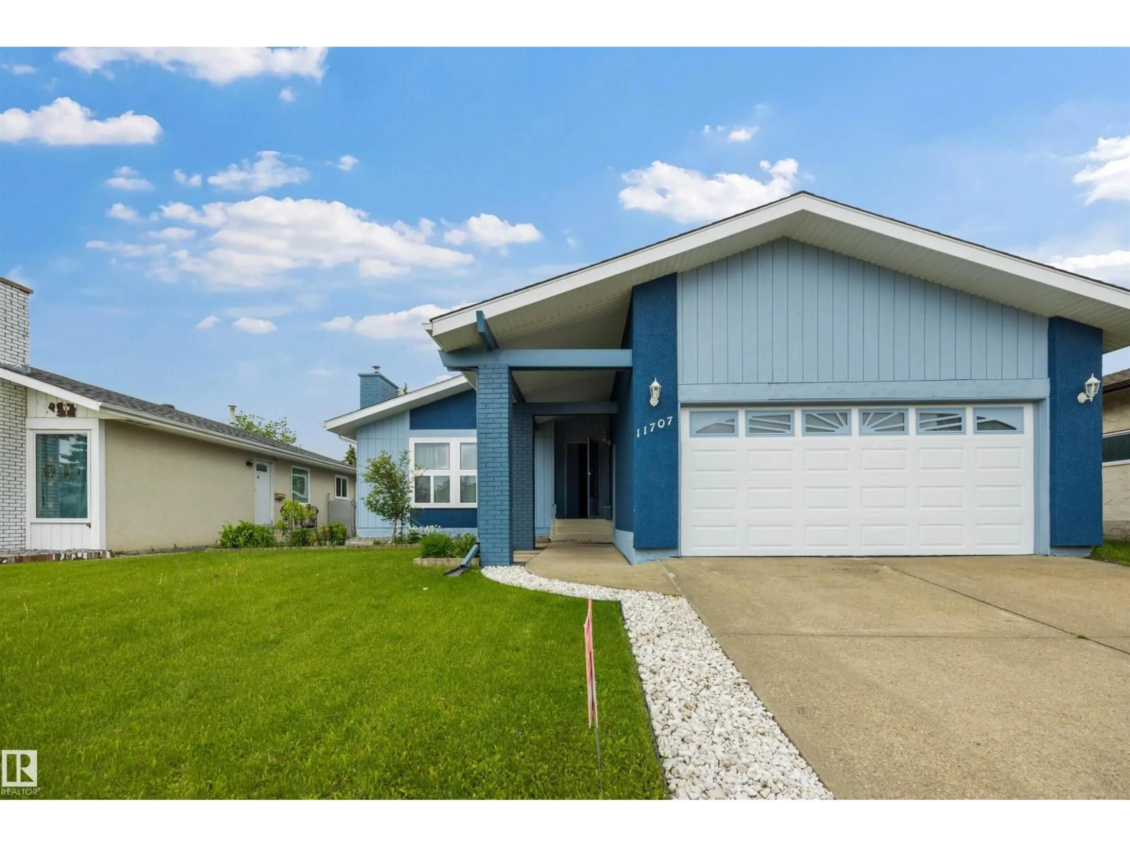 Home with vinyl exterior material, street for 11707 150 AVE NW, Edmonton Alberta T5X1C1