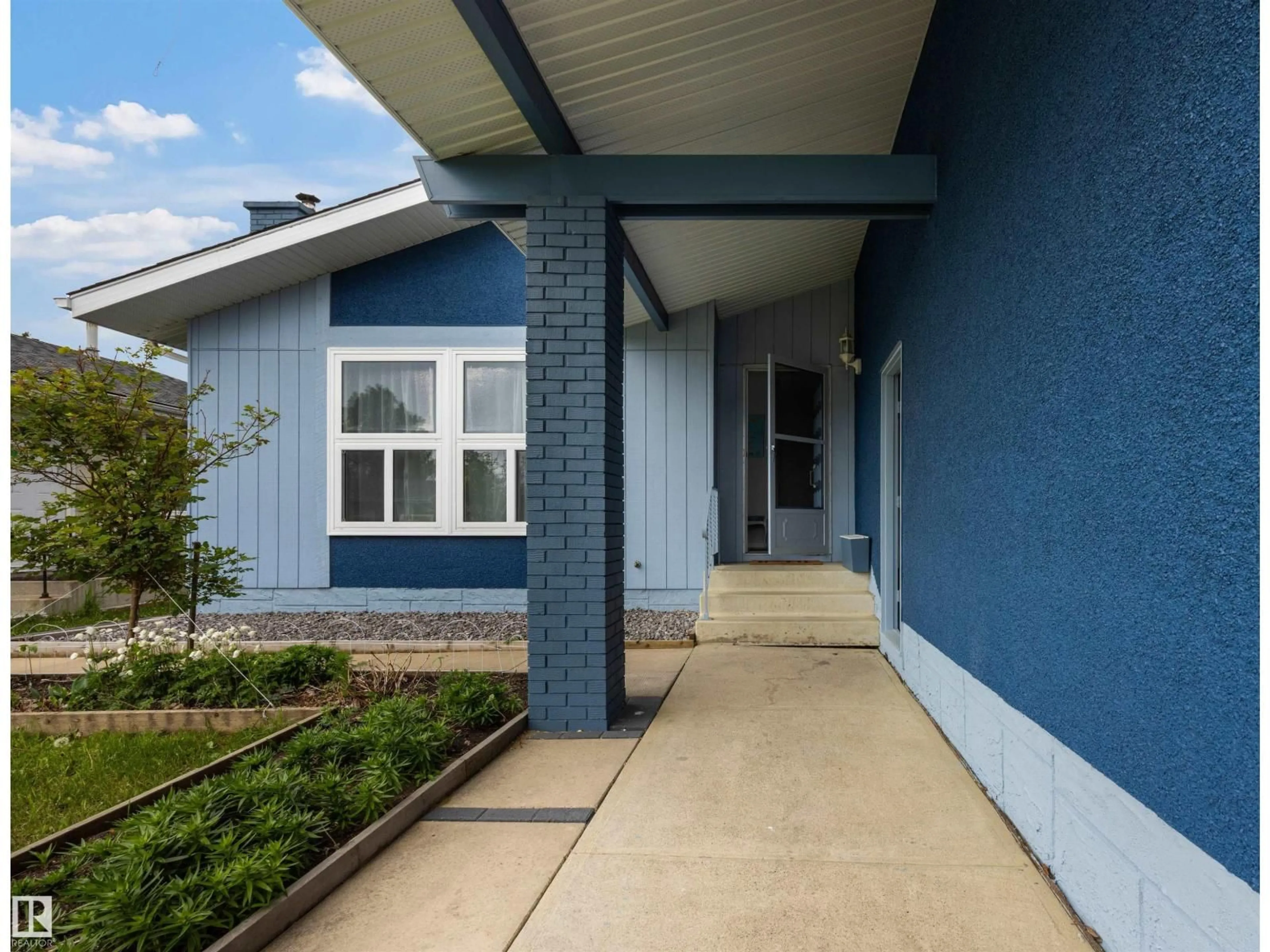 Home with vinyl exterior material, street for 11707 150 AVE NW, Edmonton Alberta T5X1C1