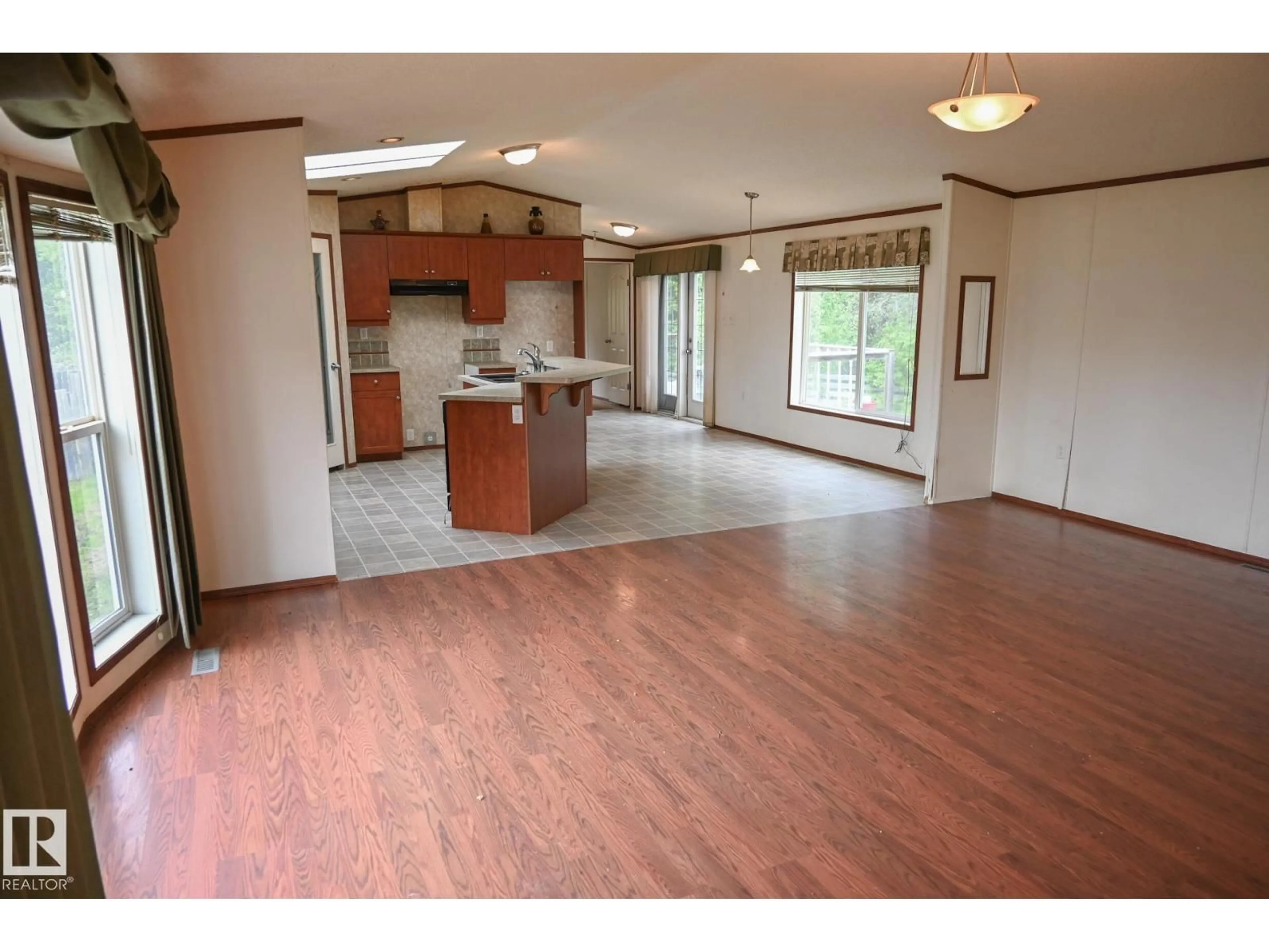 Open concept kitchen, wood/laminate floor for 4703 52 ST, Peers Alberta T0E1W0