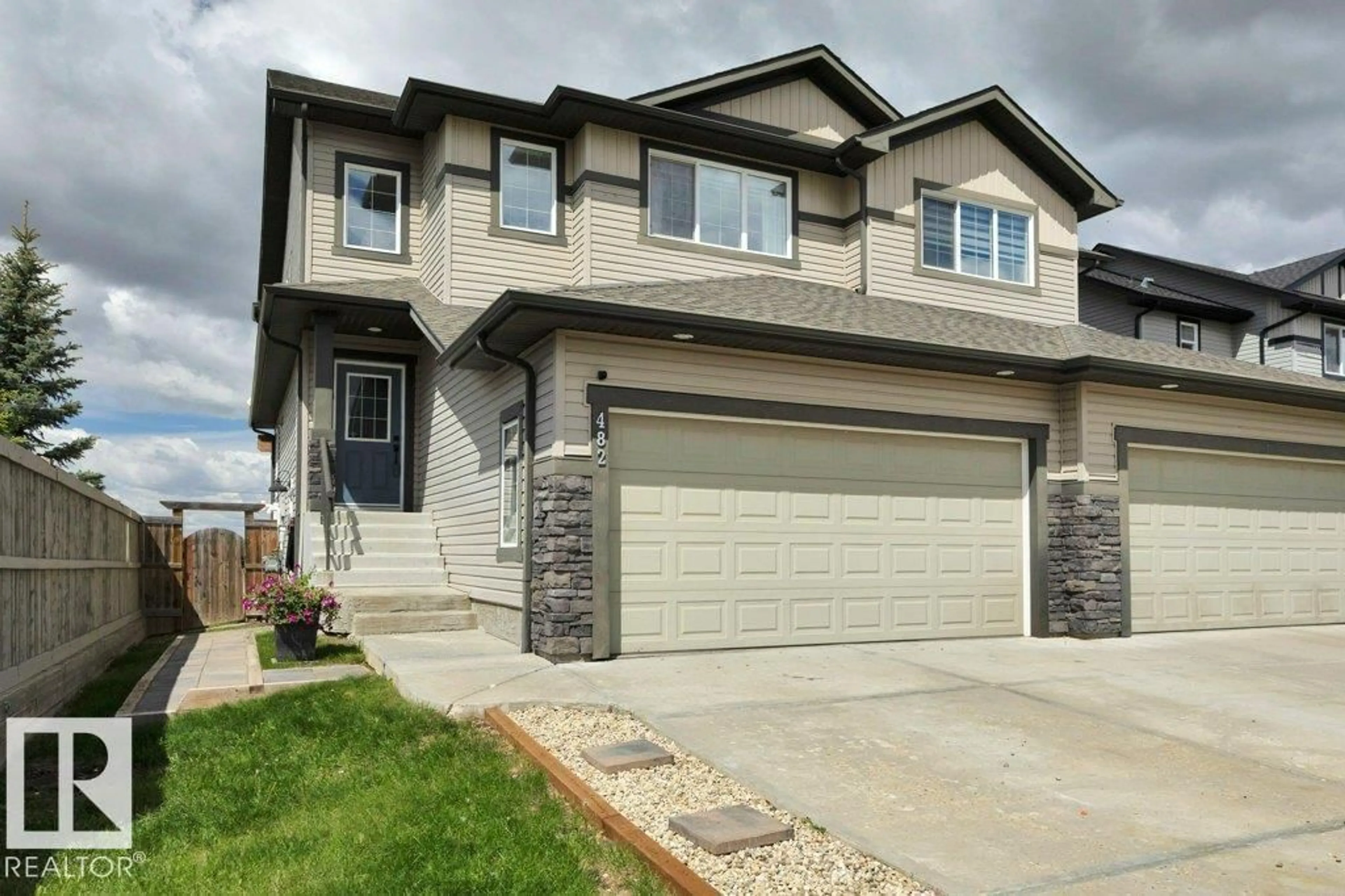 Home with vinyl exterior material, street for 482 REED CR, Leduc Alberta T9E0R5