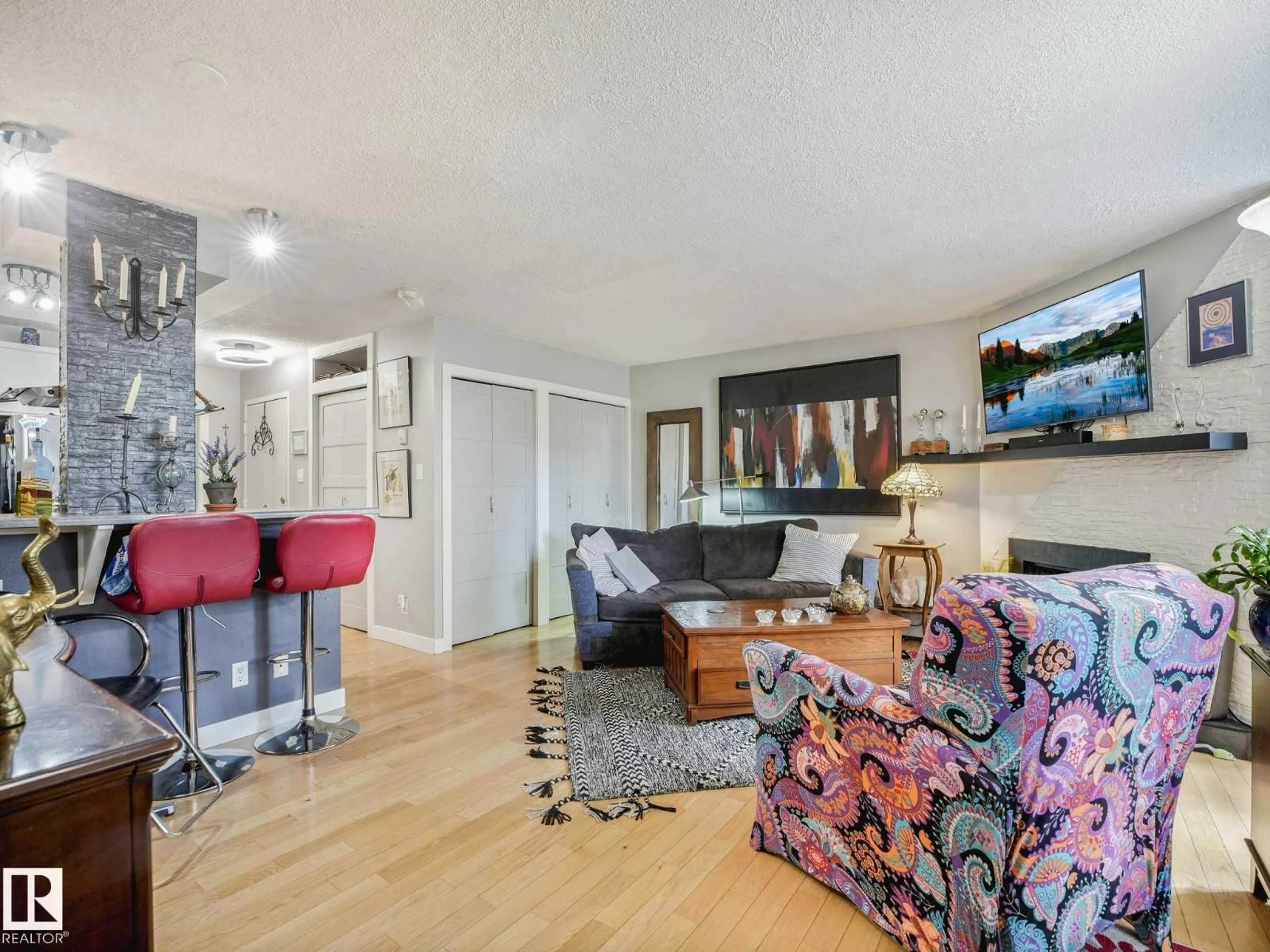 Living room with furniture, wood/laminate floor for #201 - 10148 118 ST, Edmonton Alberta T5K1Y4