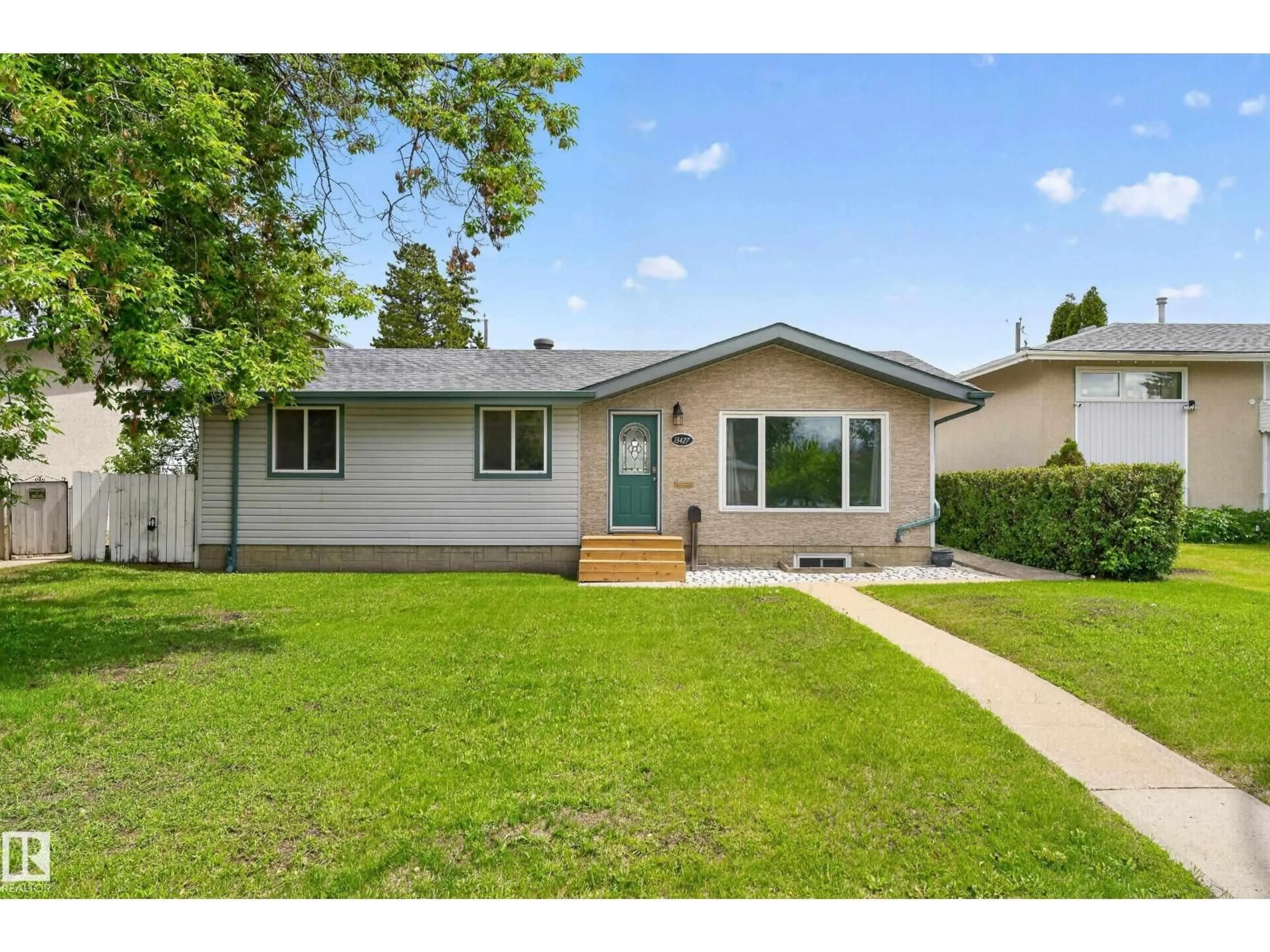 Home with vinyl exterior material, street for NW - 13427 114 ST, Edmonton Alberta T5E5E5