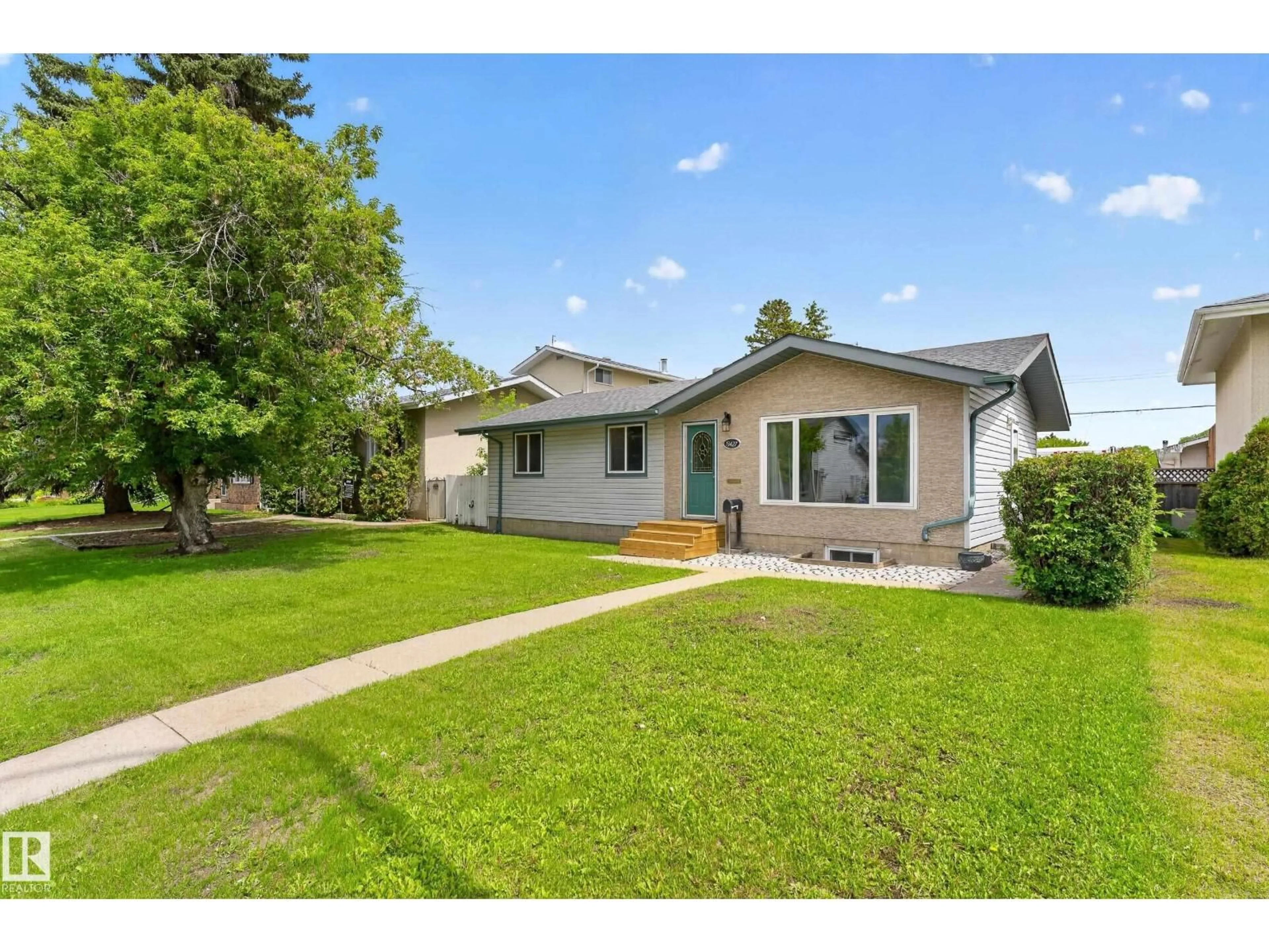 Home with vinyl exterior material, street for NW - 13427 114 ST, Edmonton Alberta T5E5E5