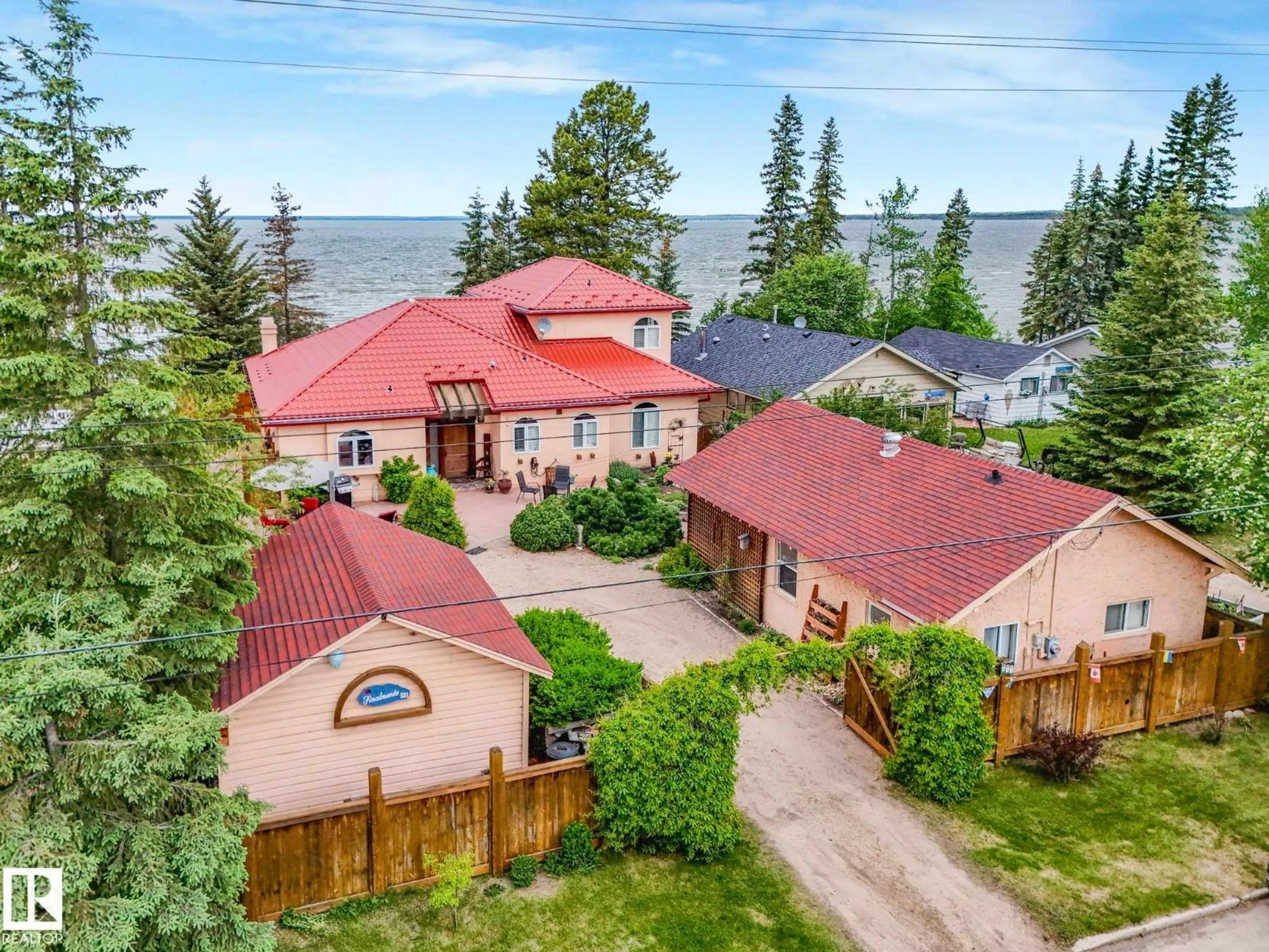 A pic from outside/outdoor area/front of a property/back of a property/a pic from drone, water/lake/river/ocean view for 511 1 AV, Rural Wetaskiwin County Alberta T0C2V0
