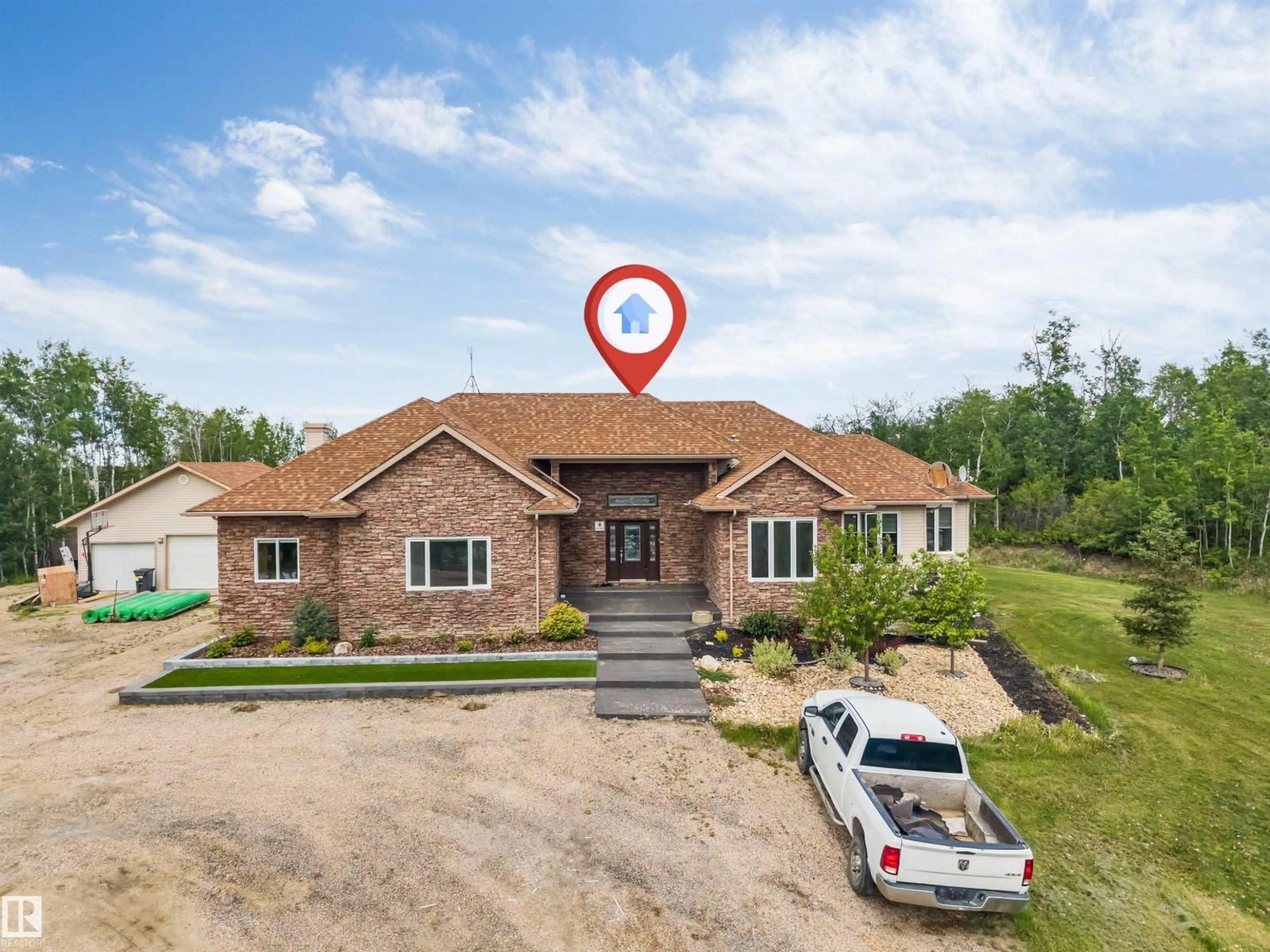 A pic from outside/outdoor area/front of a property/back of a property/a pic from drone, building for 330 - 50150 RGE RD 232 NE, Rural Leduc County Alberta T9C1G3
