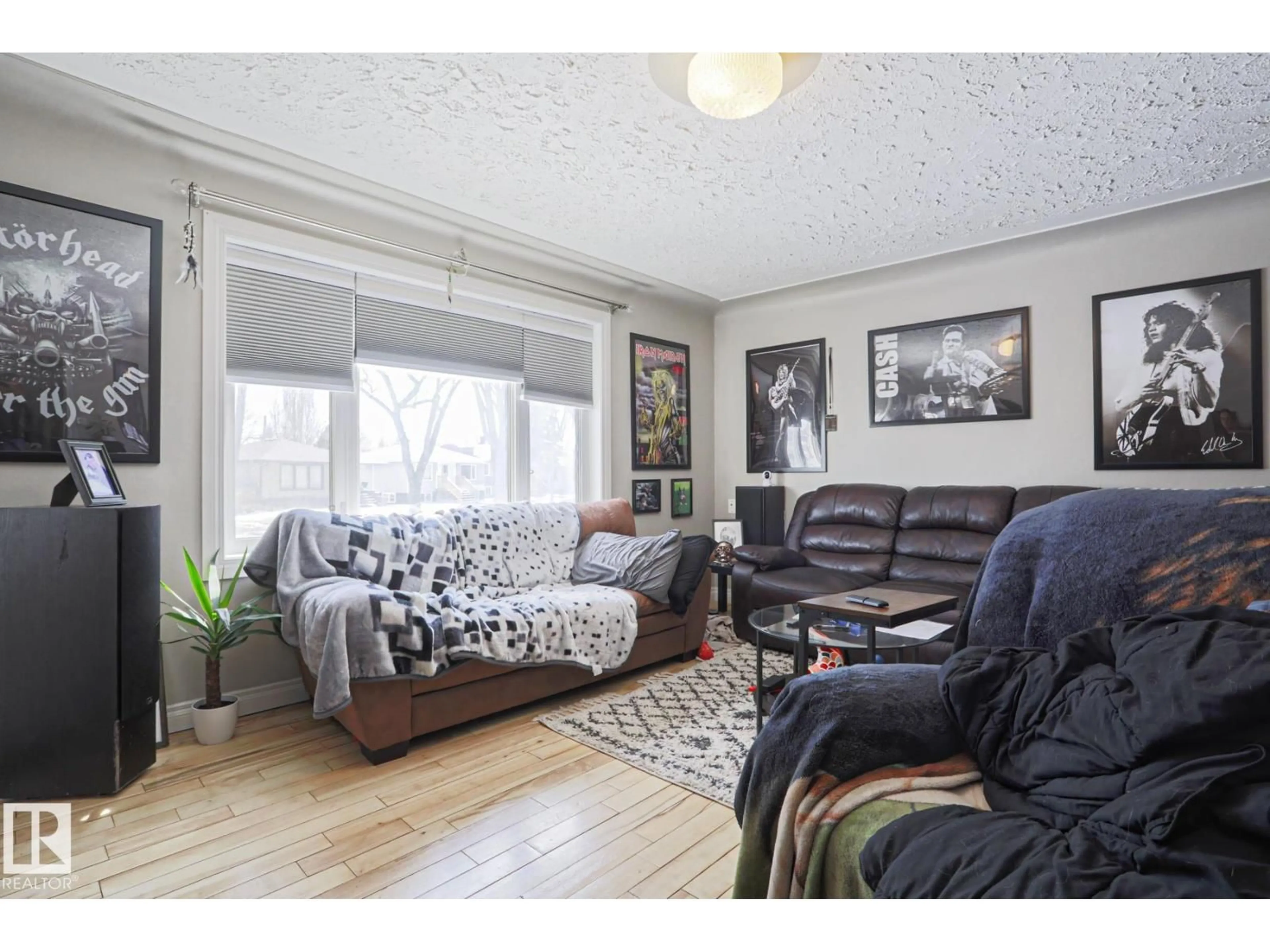 Living room with furniture, wood/laminate floor for 12418 93 ST, Edmonton Alberta T6G1G5