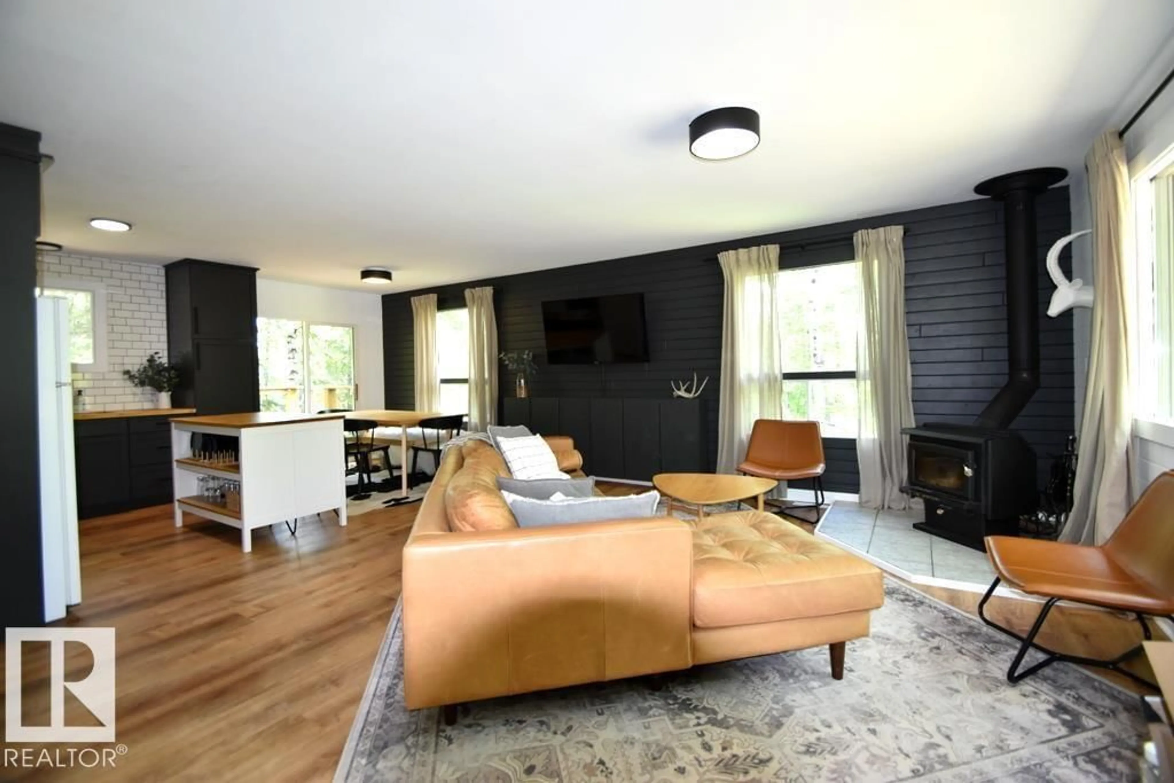 Living room with furniture, wood/laminate floor for 415 SUNSET ROAD, Rural Athabasca County Alberta T0A0M0