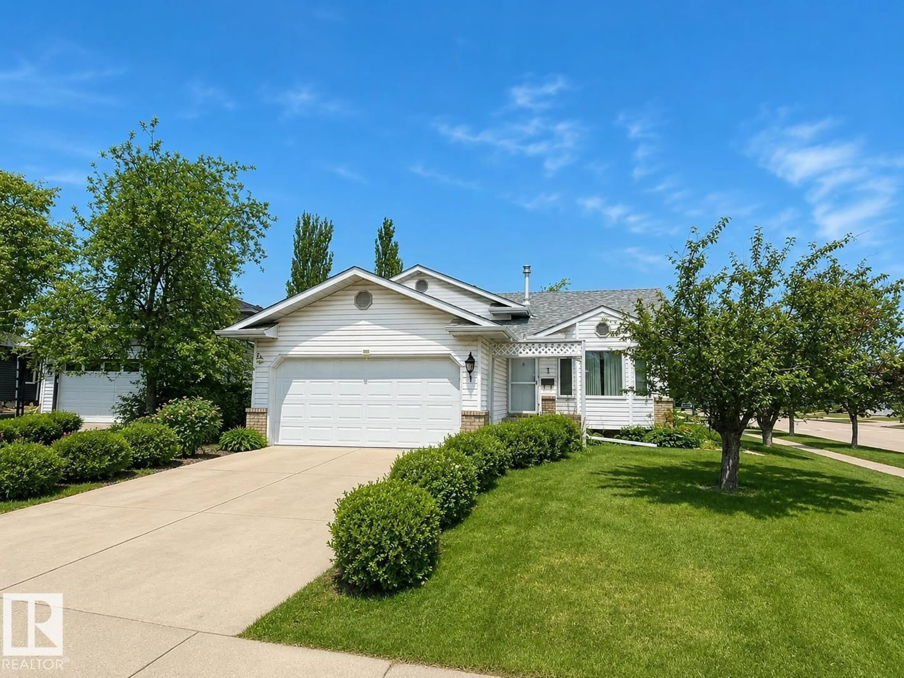 Home with vinyl exterior material, street for 1 MUNRO CO, Leduc Alberta T9E6N6