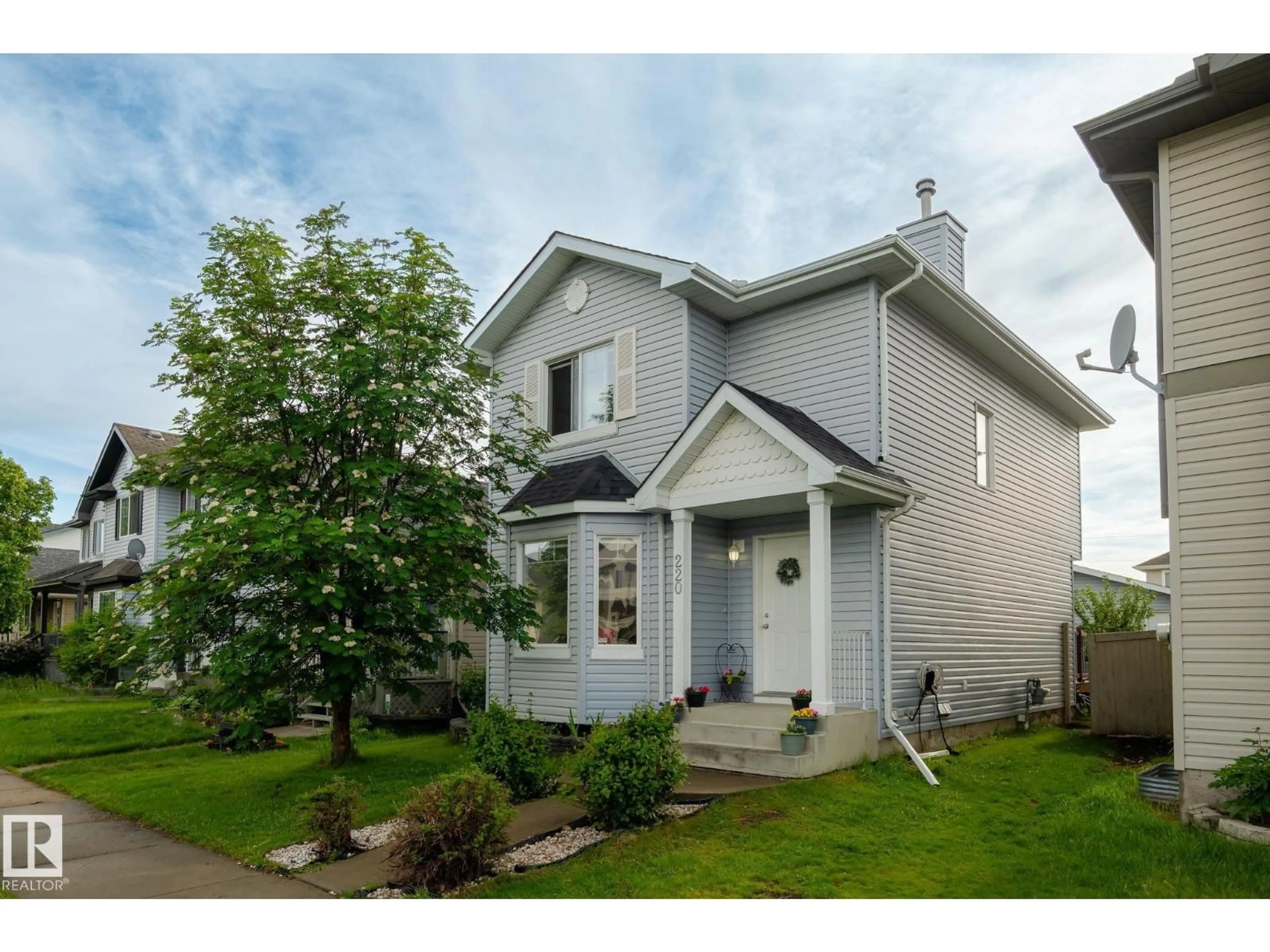 Home with vinyl exterior material, street for SW - 220 85 ST, Edmonton Alberta T6X1H5