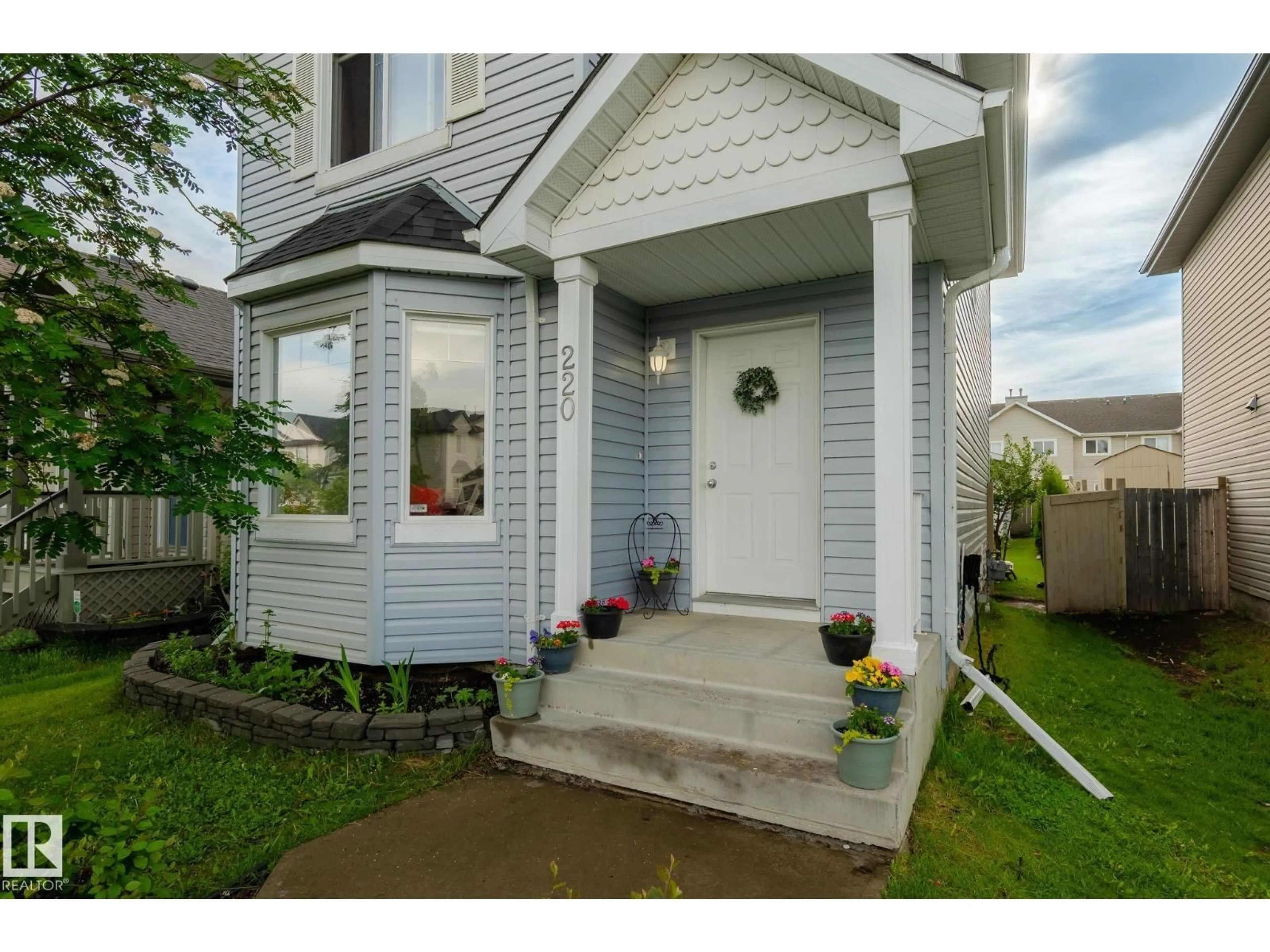 Home with vinyl exterior material, street for SW - 220 85 ST, Edmonton Alberta T6X1H5