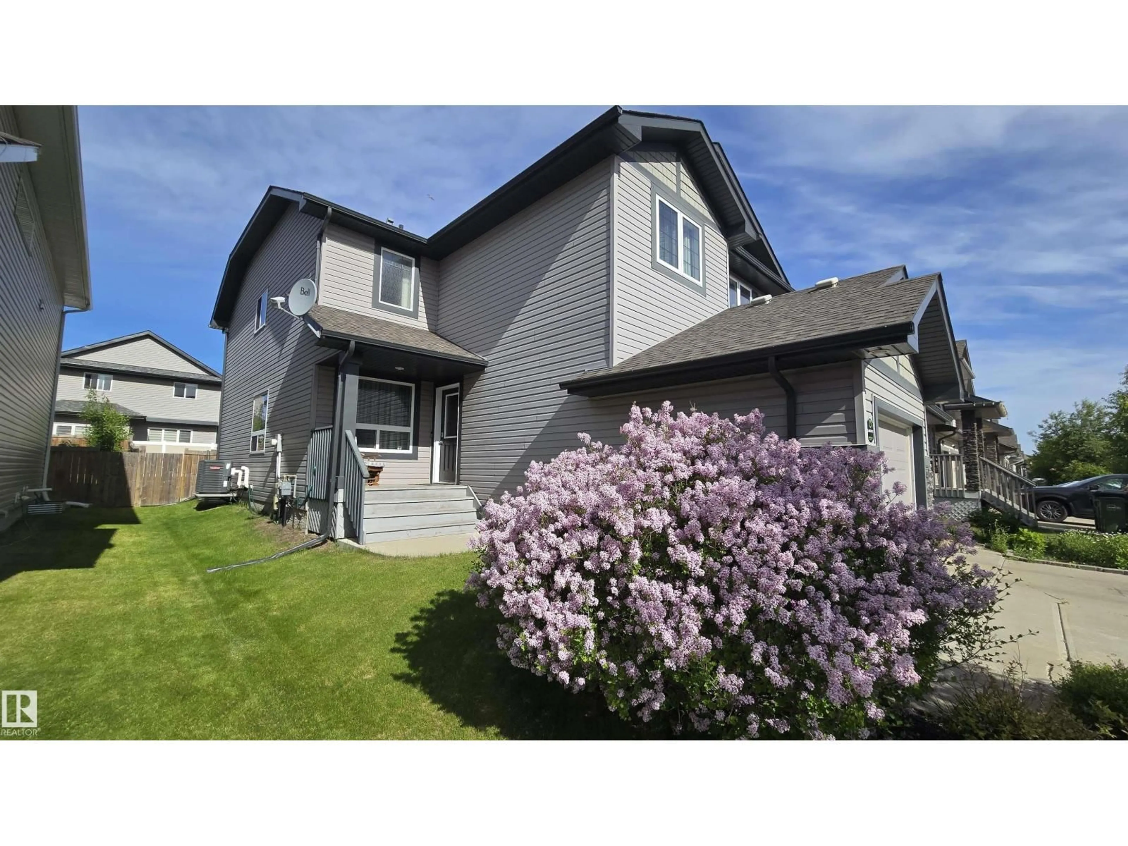 Home with vinyl exterior material, street for NW - 16730 53 ST, Edmonton Alberta T5Y0R6