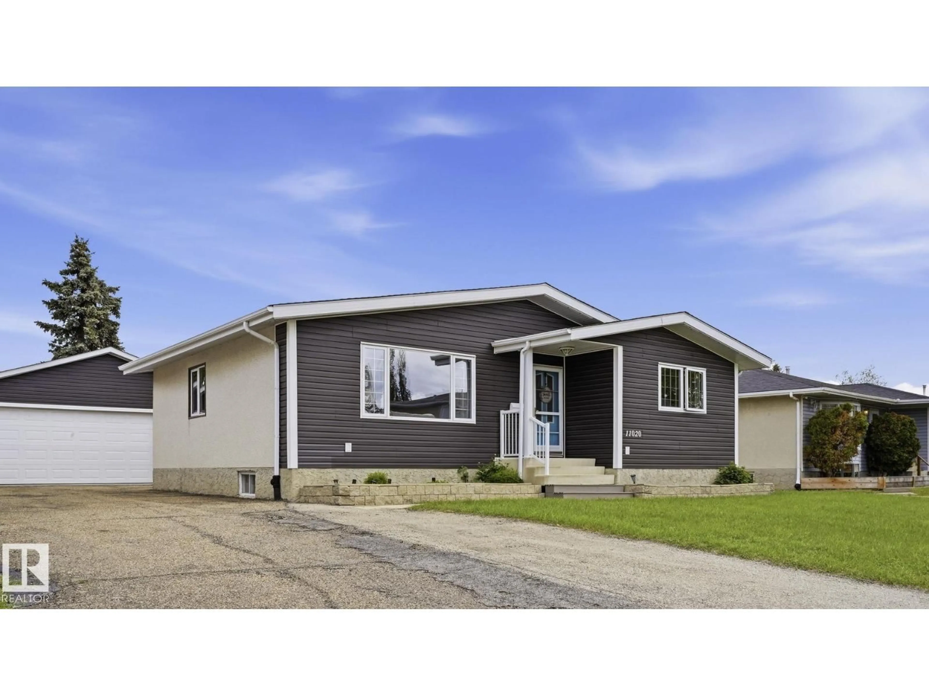 Home with vinyl exterior material, street for 11020 162A AV, Edmonton Alberta T5X2A1