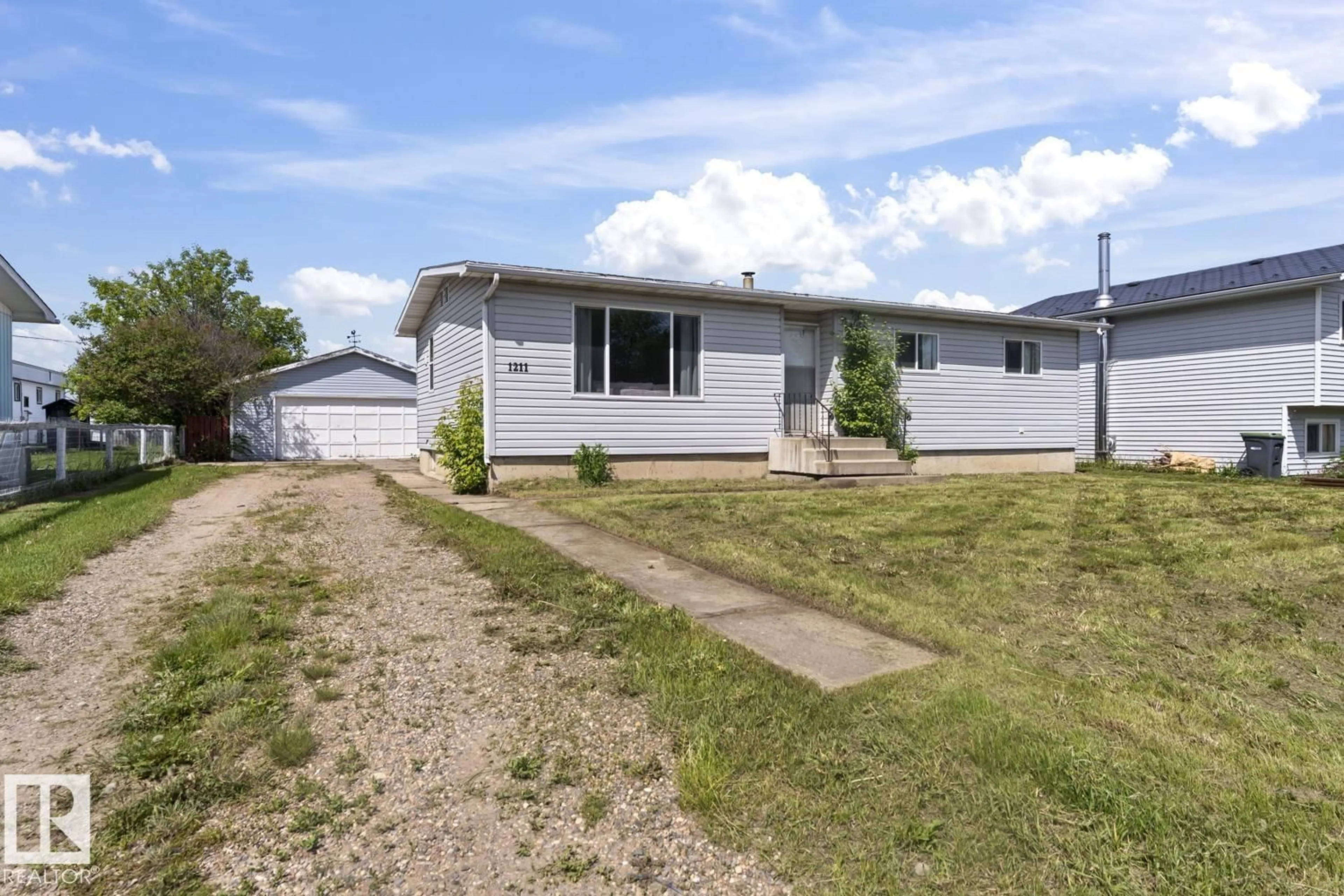 Home with vinyl exterior material, street for 1211 8 ST, Cold Lake Alberta T9M1J7