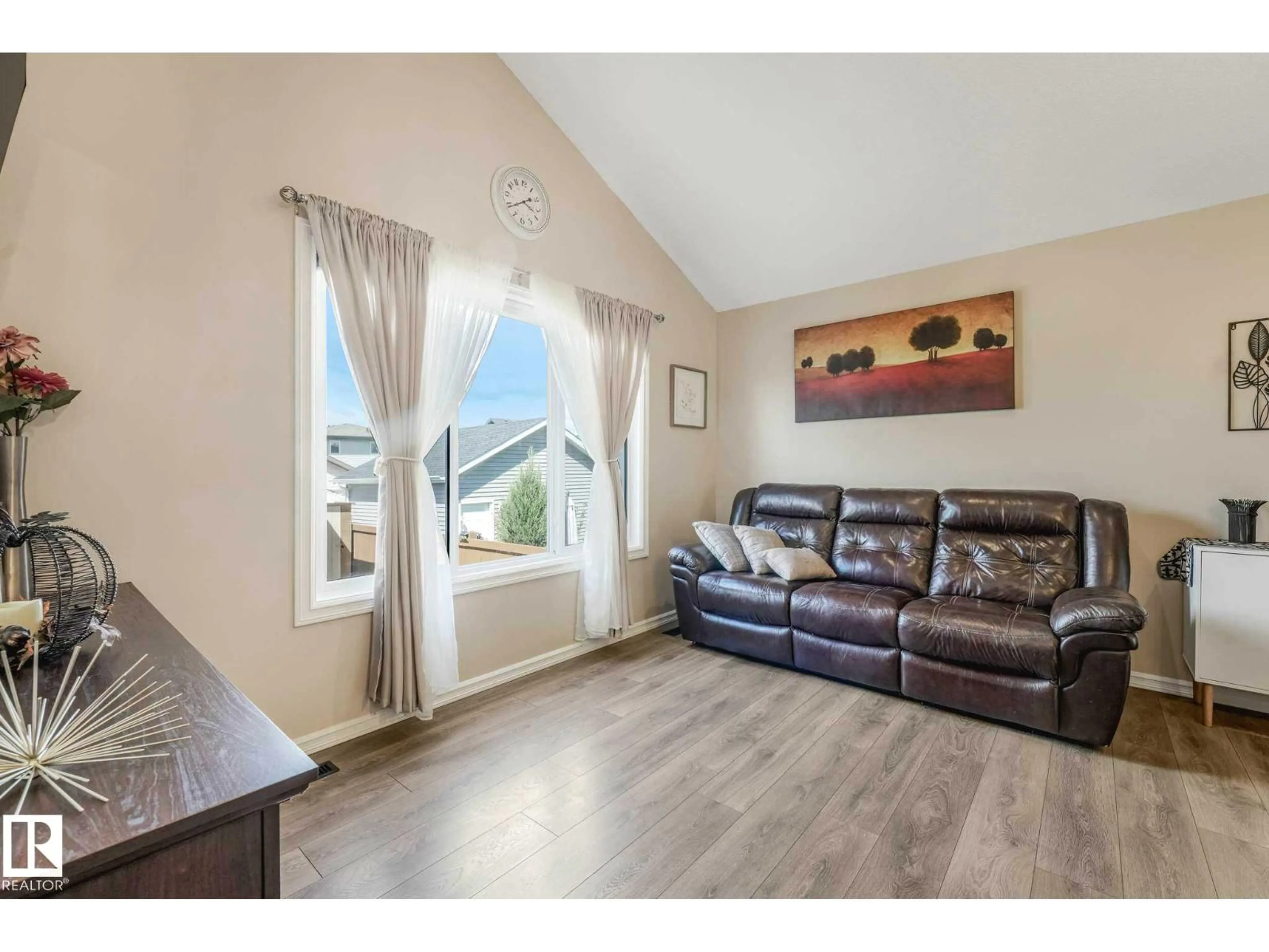Living room with furniture, wood/laminate floor for 16024 12 AV, Edmonton Alberta T6W2W6