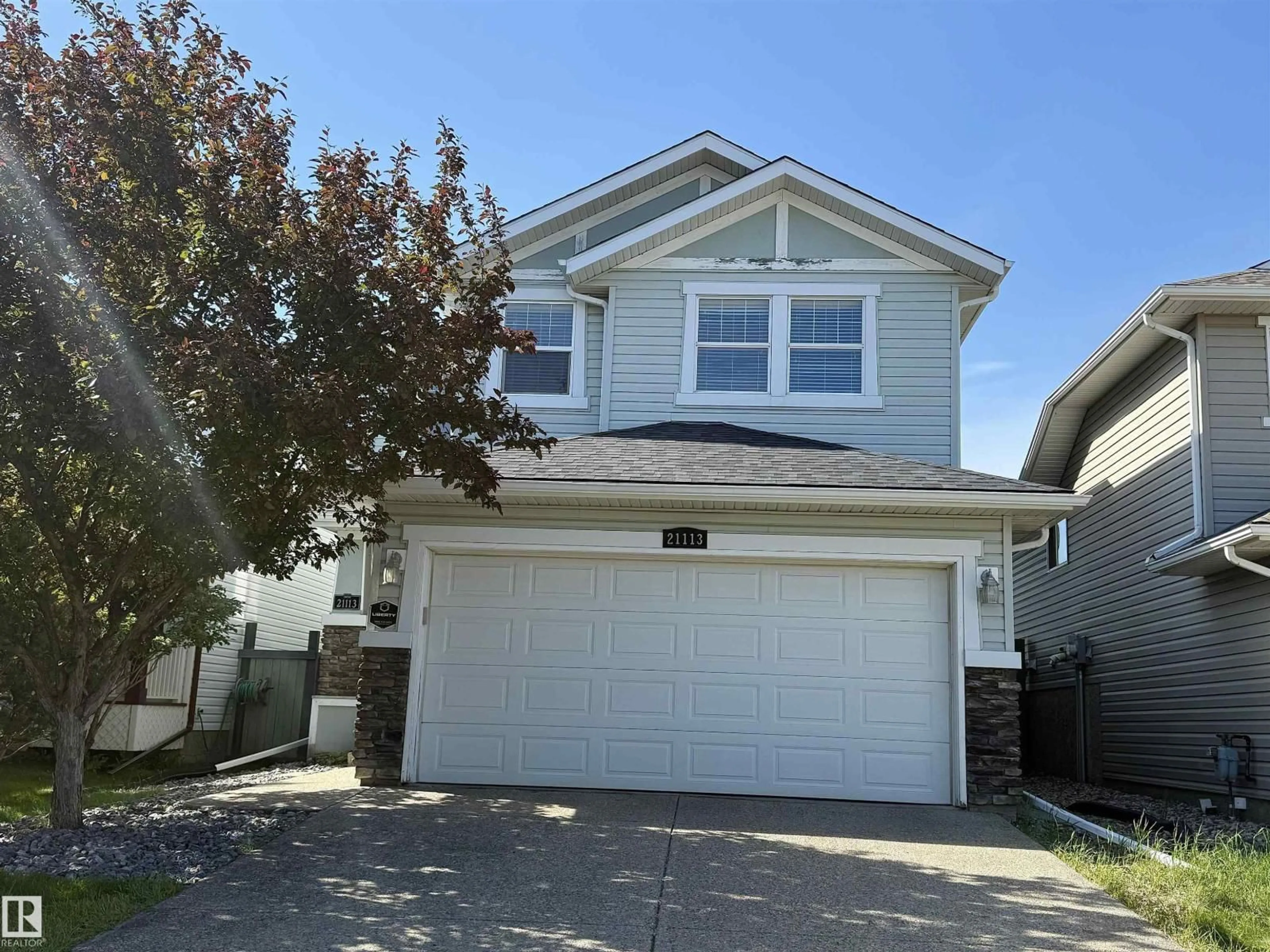Home with vinyl exterior material, street for 21113 92A AV, Edmonton Alberta T5T6Z2