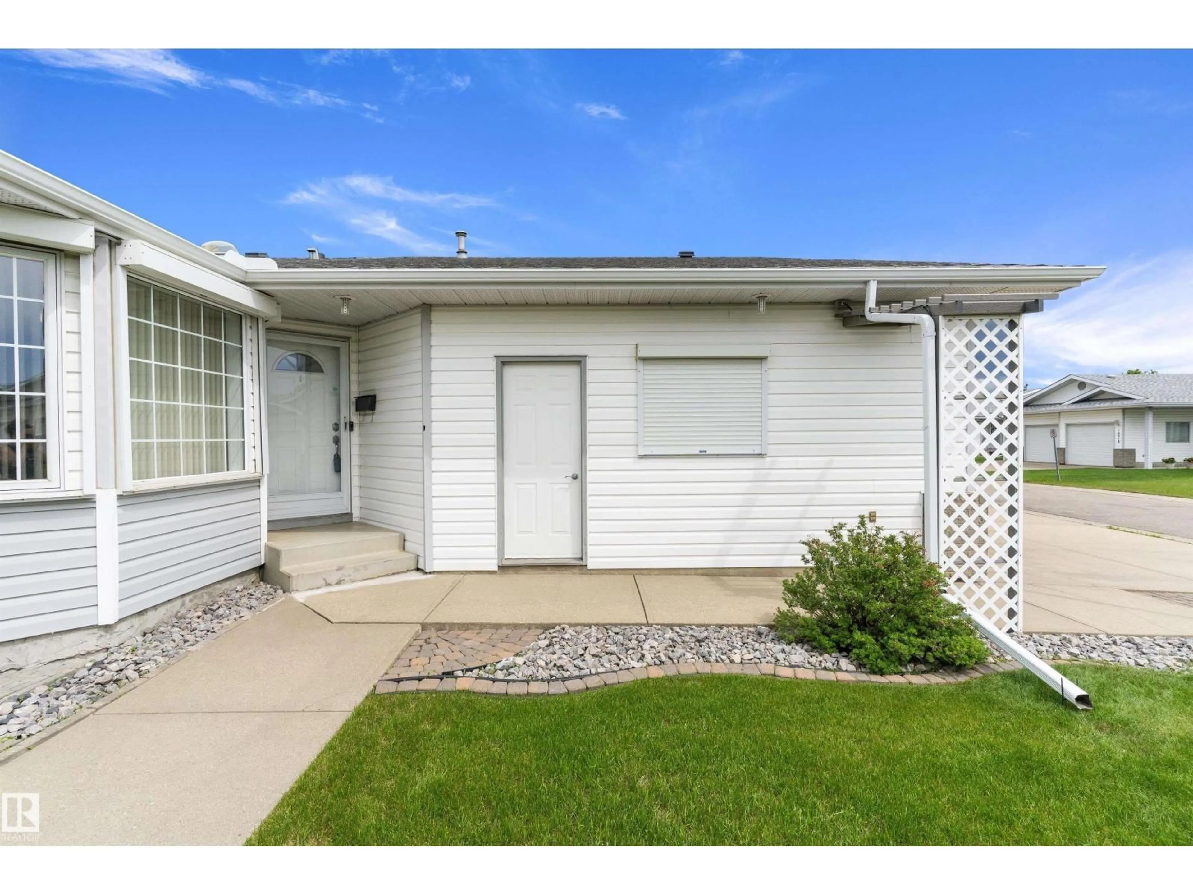Home with vinyl exterior material, street for NW - 15577 59A ST, Edmonton Alberta T5Y2M8