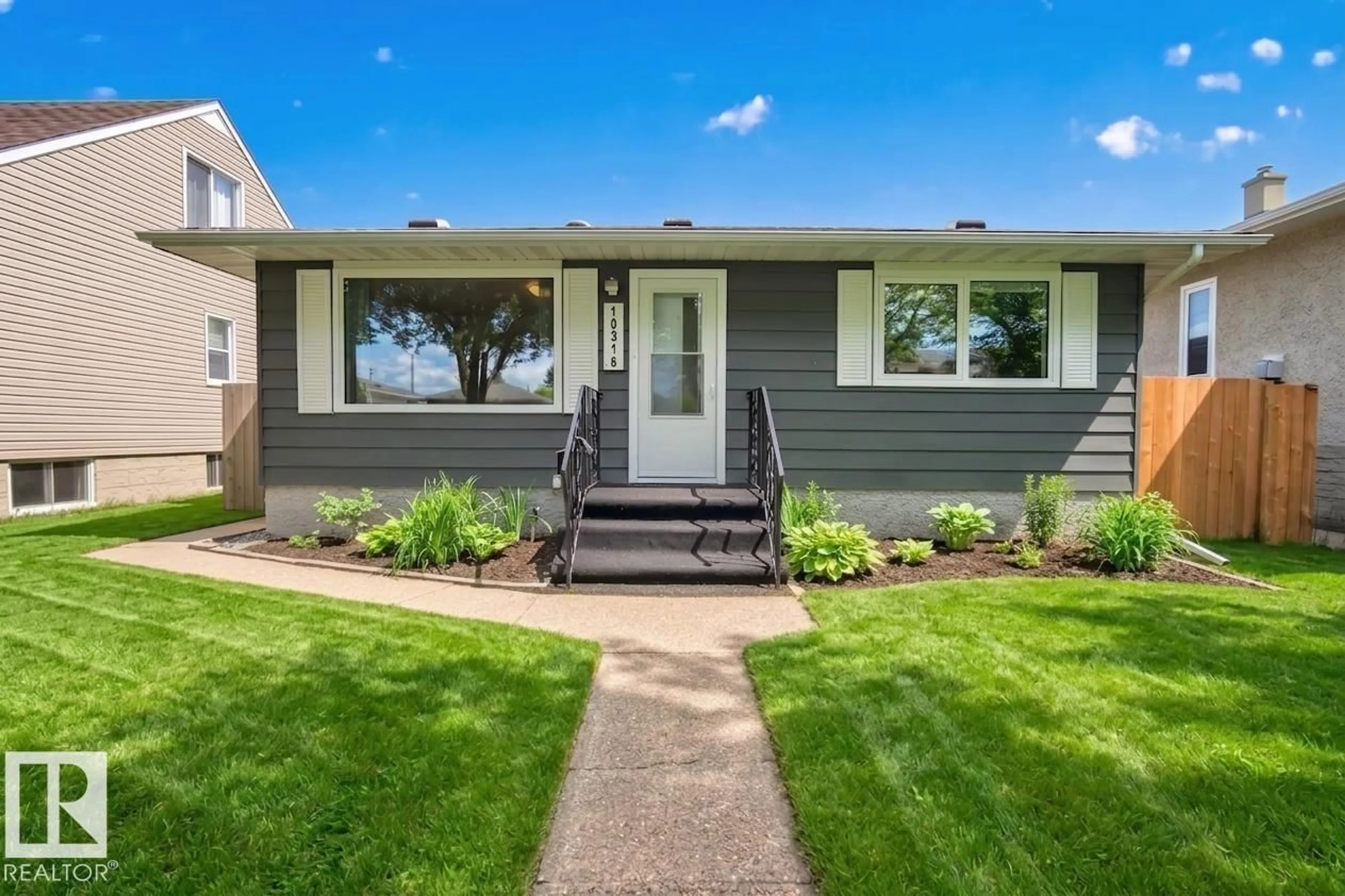 Home with vinyl exterior material, street for 10316 77 ST, Edmonton Alberta T6A3C3