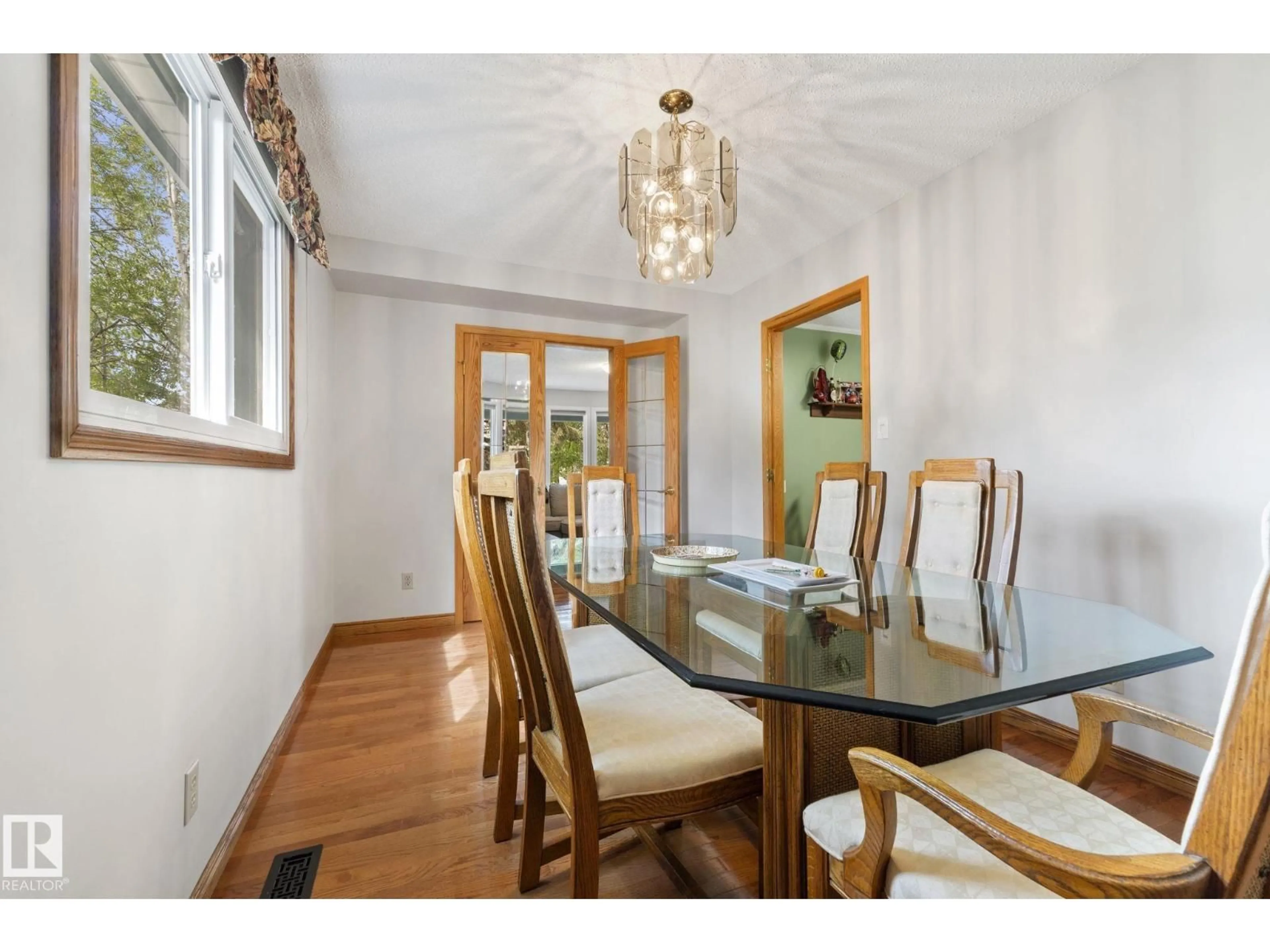 Dining room, wood/laminate floor for 9940 83 ST, Fort Saskatchewan Alberta T8L3H3