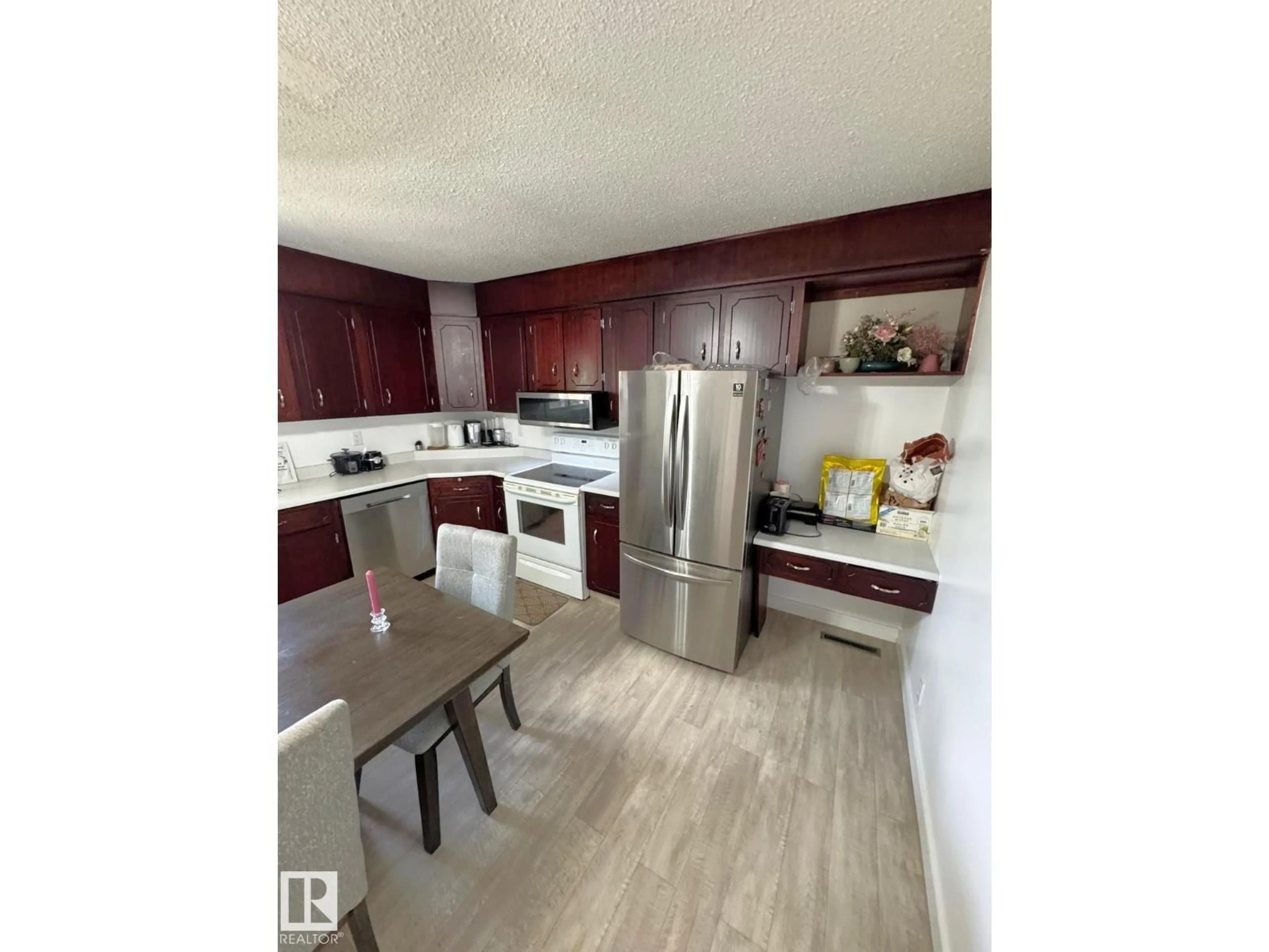 Open concept kitchen, wood/laminate floor for 5093 45 ST, Drayton Valley Alberta T7A1C2