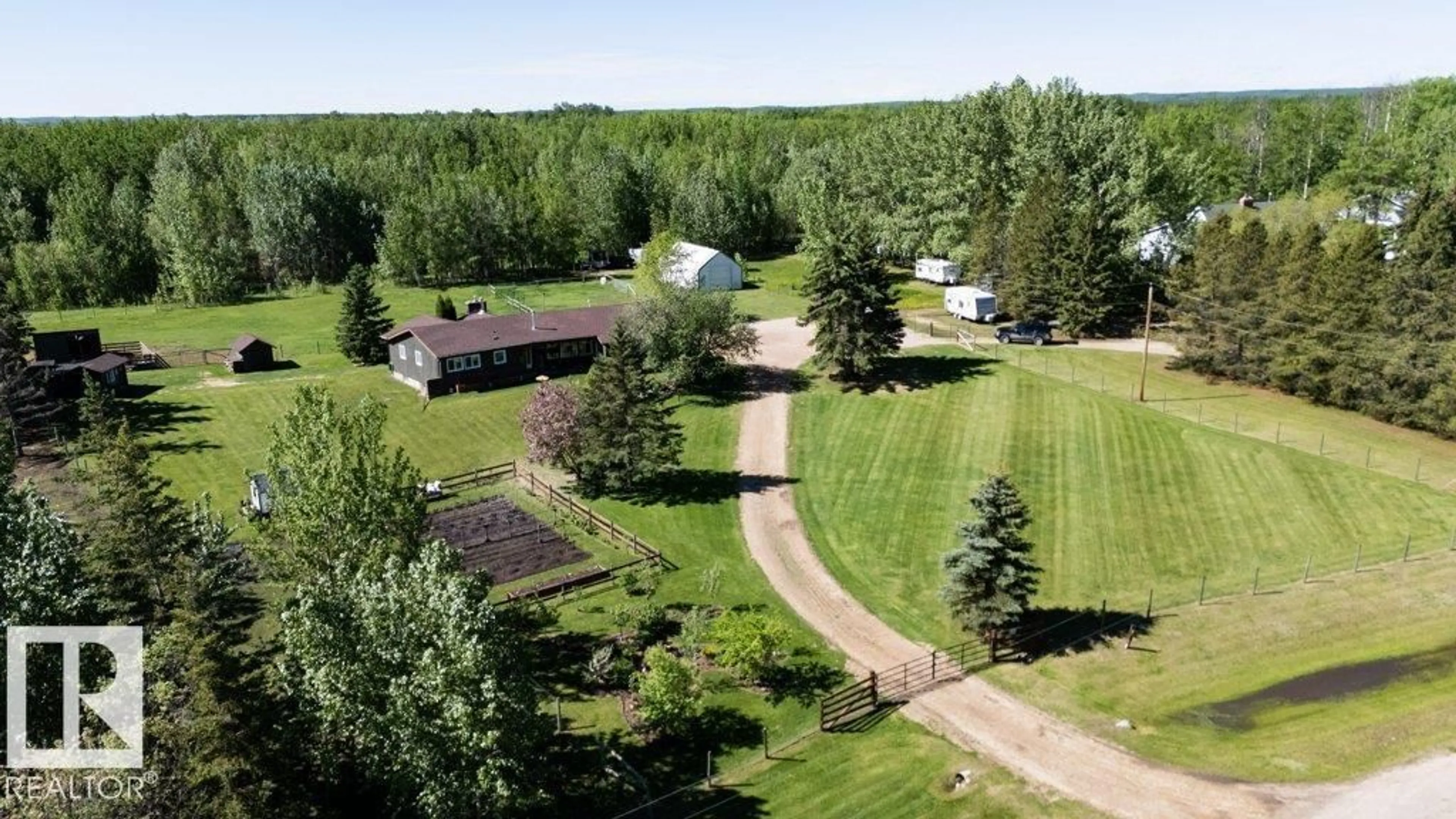 A pic from outside/outdoor area/front of a property/back of a property/a pic from drone, mountain view for 107 - 59329 RGE RD 51, Rural Barrhead County Alberta T7N1N8
