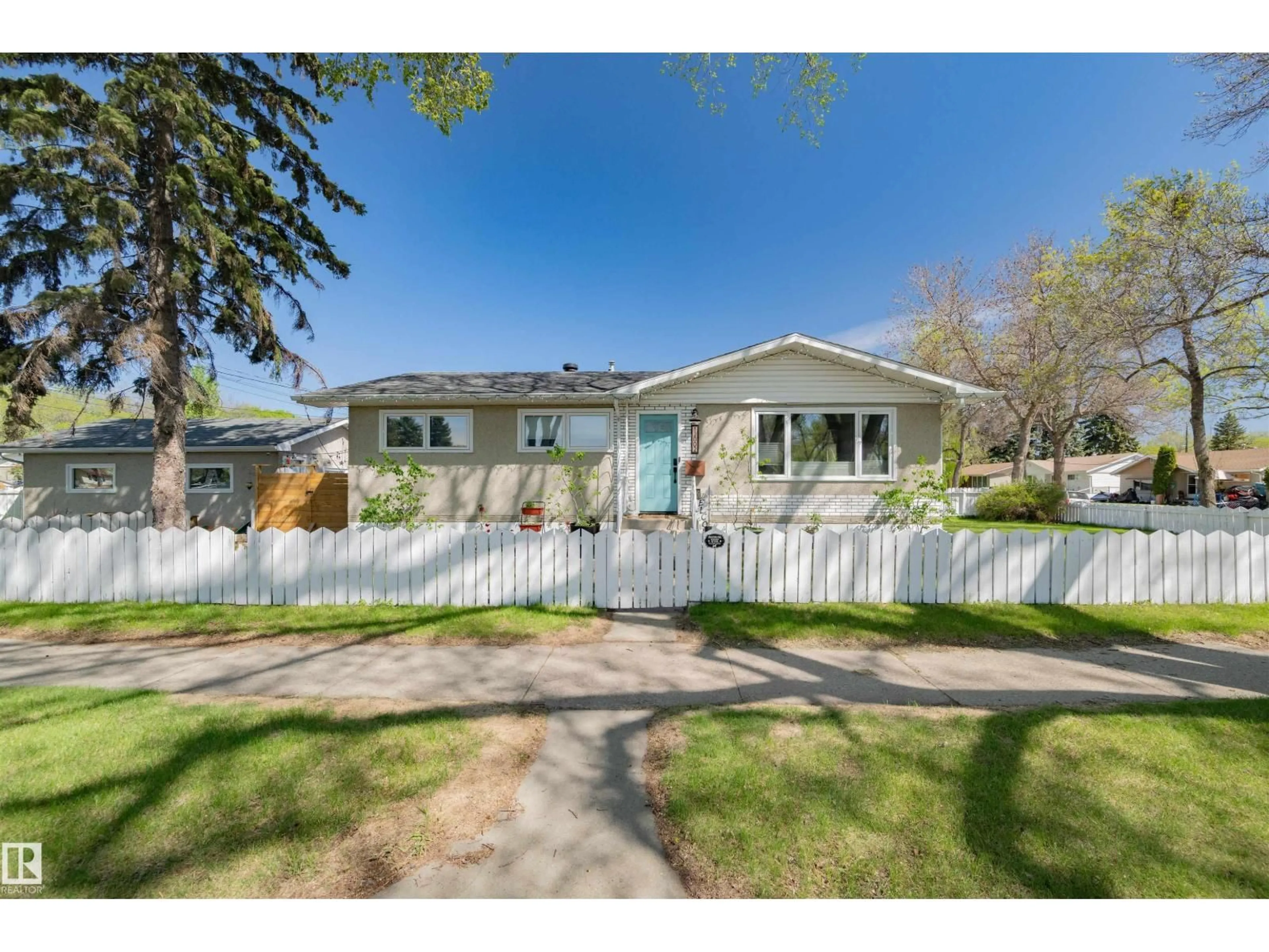 Home with vinyl exterior material, street for NW - 12002 39 ST, Edmonton Alberta T5W2J8