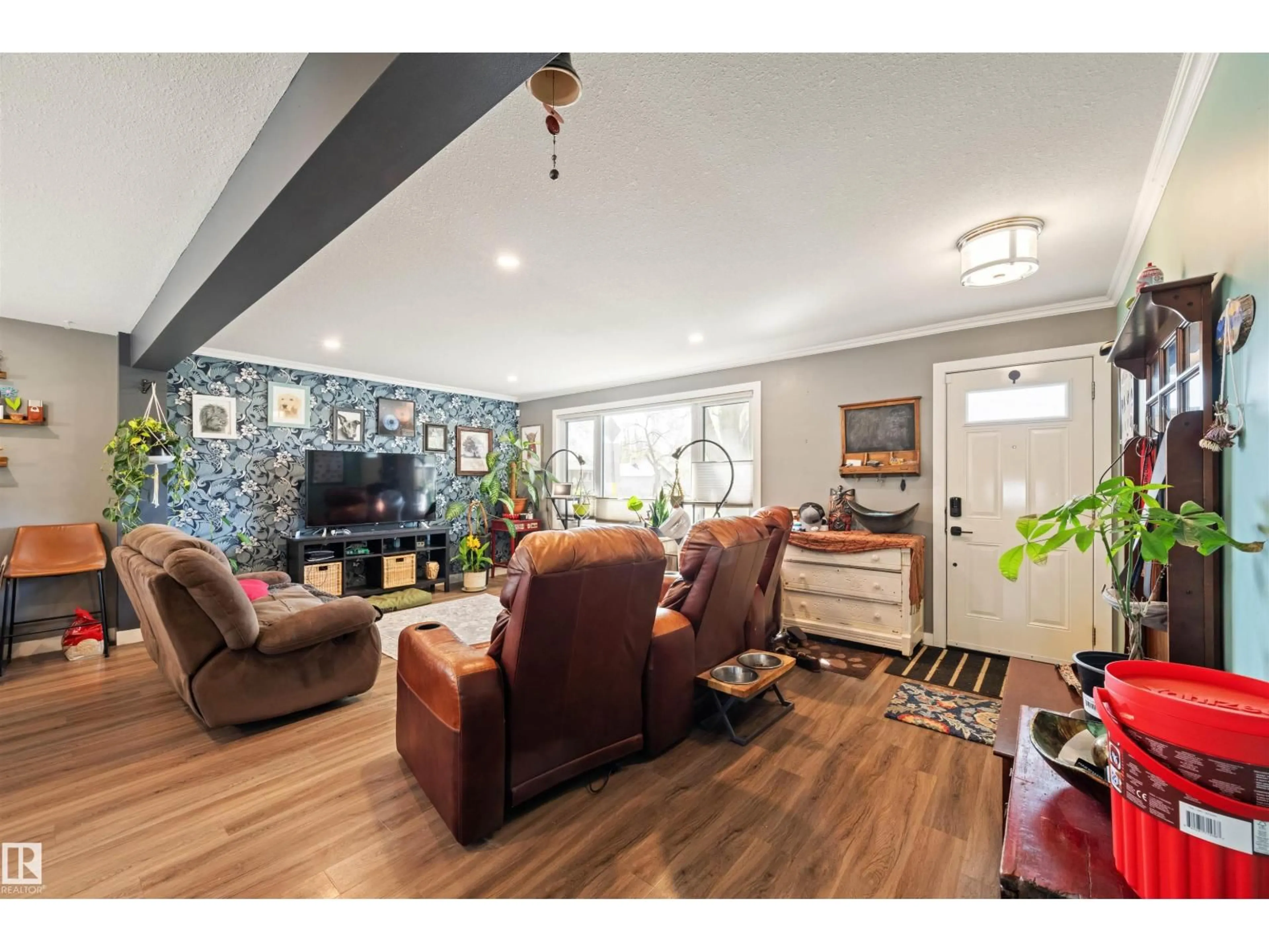 Living room with furniture, wood/laminate floor for NW - 12002 39 ST, Edmonton Alberta T5W2J8