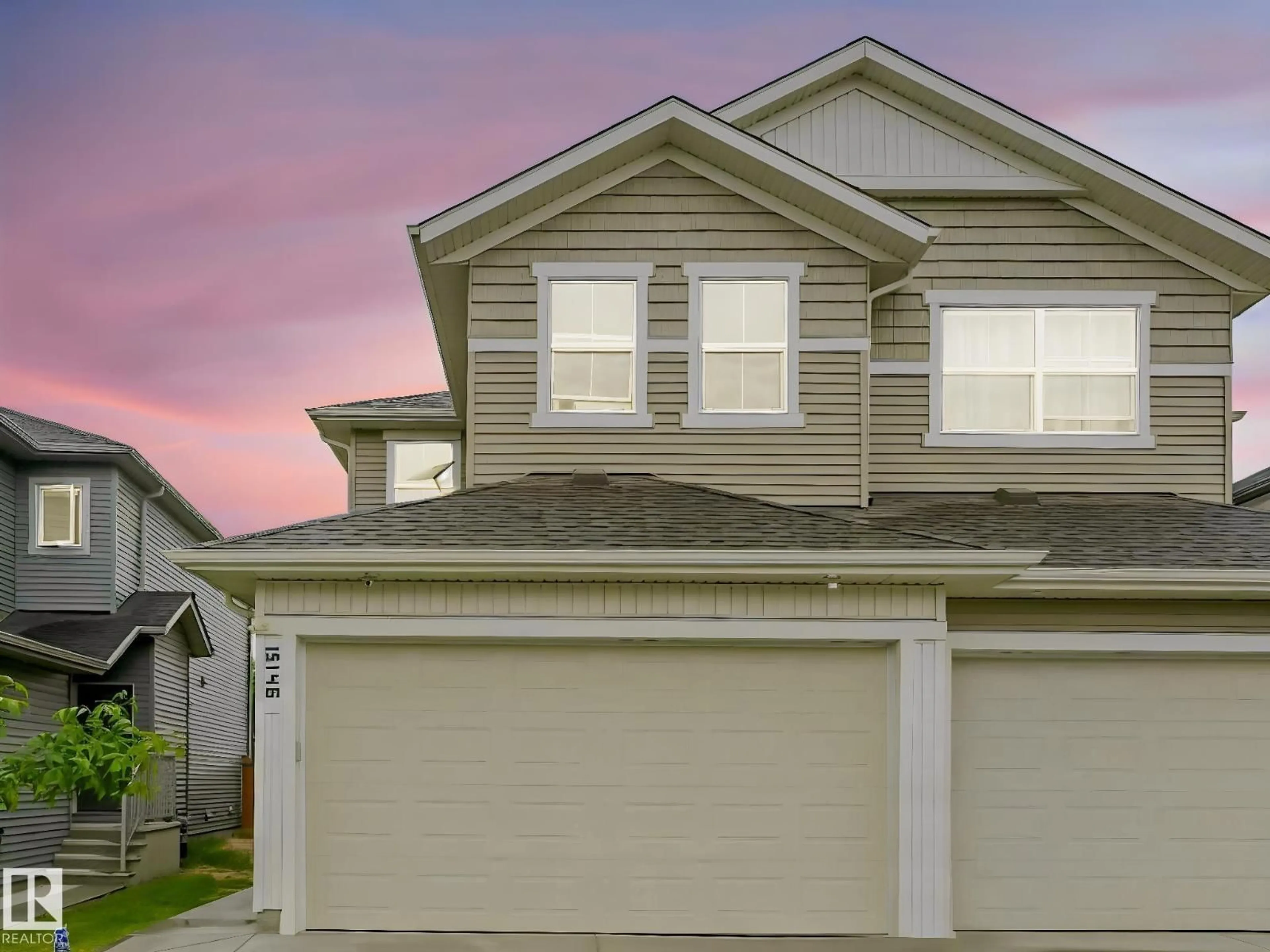 Home with vinyl exterior material, street for 15146 26 ST, Edmonton Alberta T5Y2G8