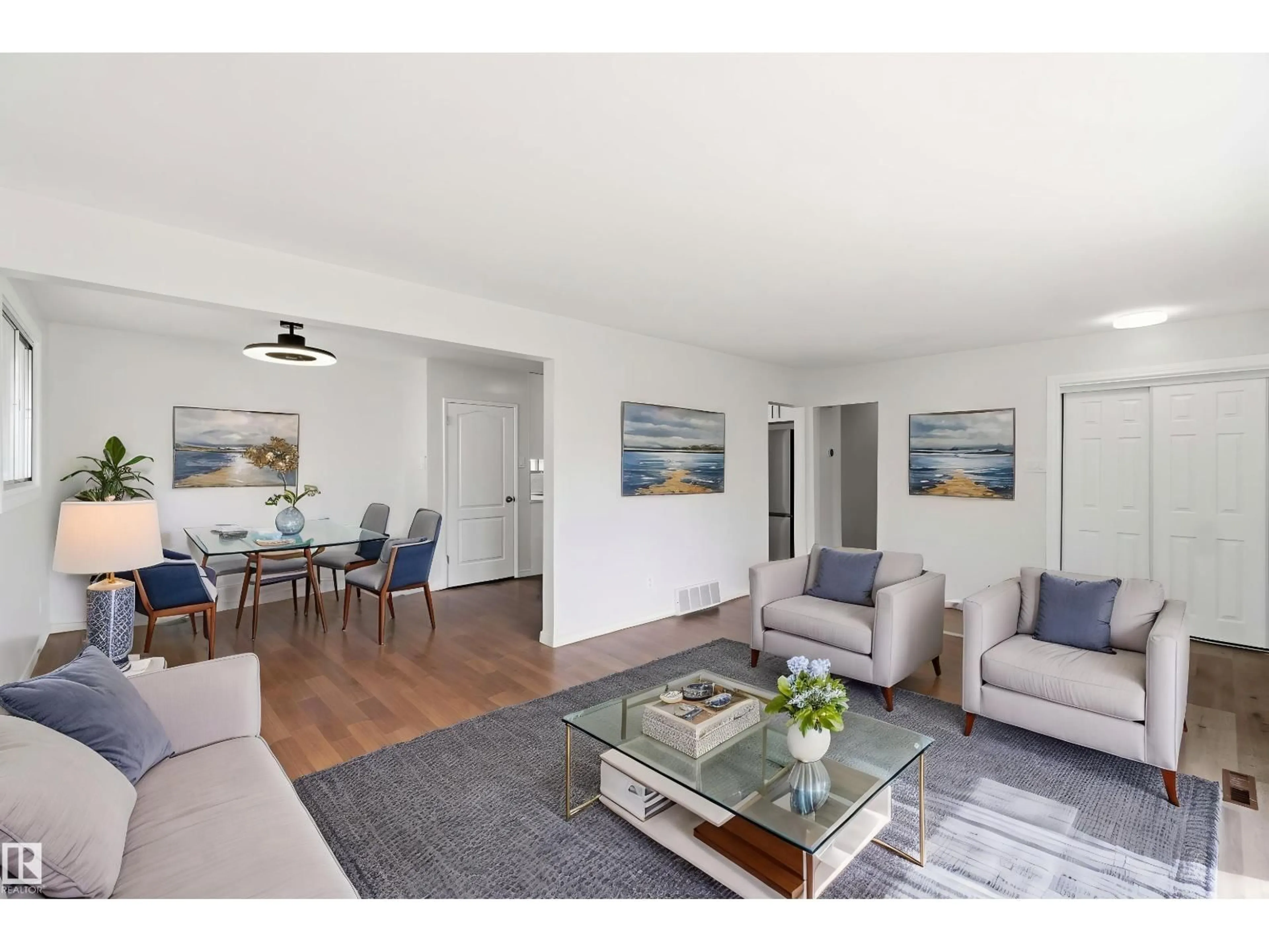 Living room with furniture, wood/laminate floor for NW - 13303 58 ST, Edmonton Alberta T5A0P9