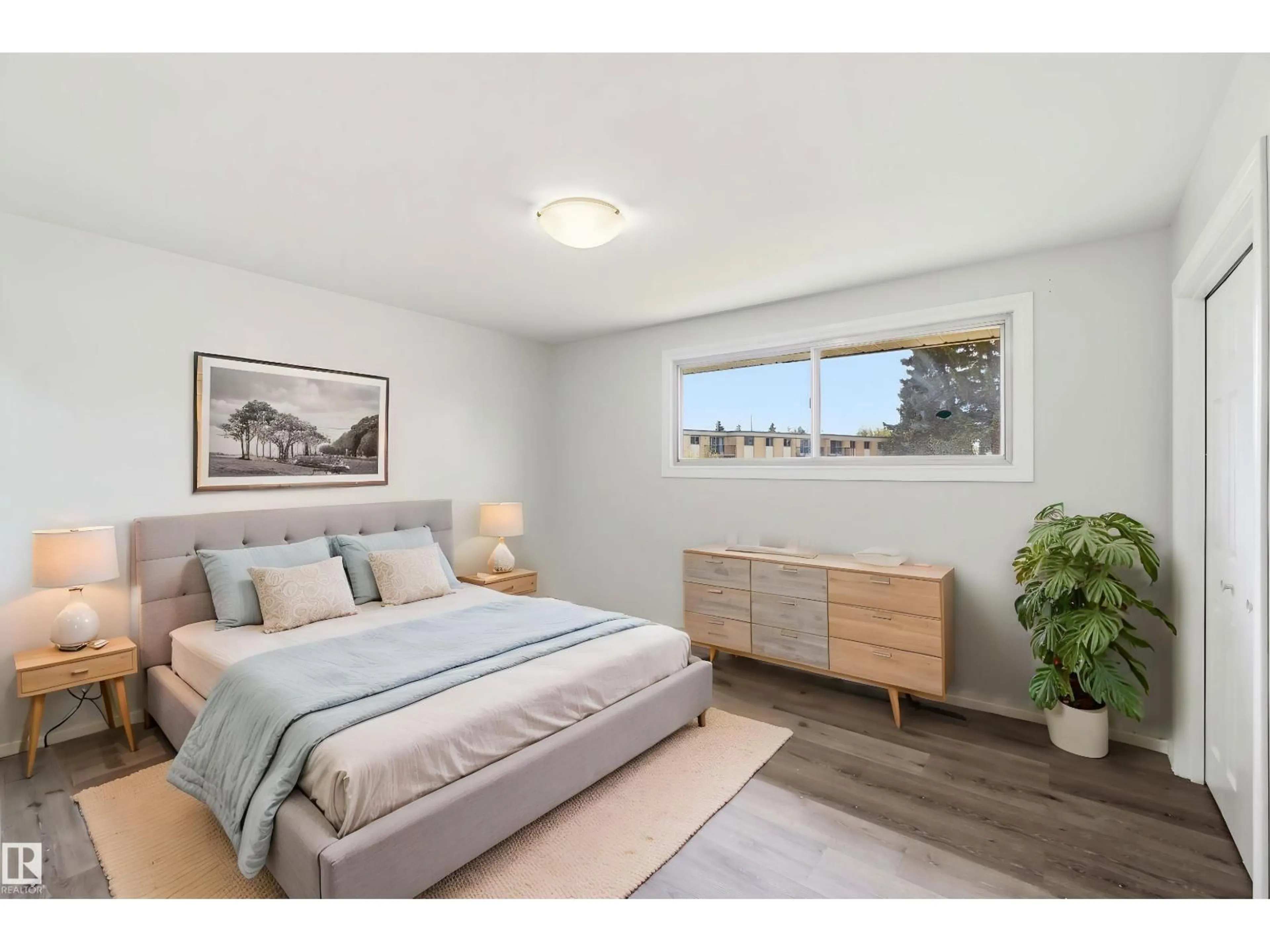 Bedroom with bed, wood/laminate floor for NW - 13303 58 ST, Edmonton Alberta T5A0P9