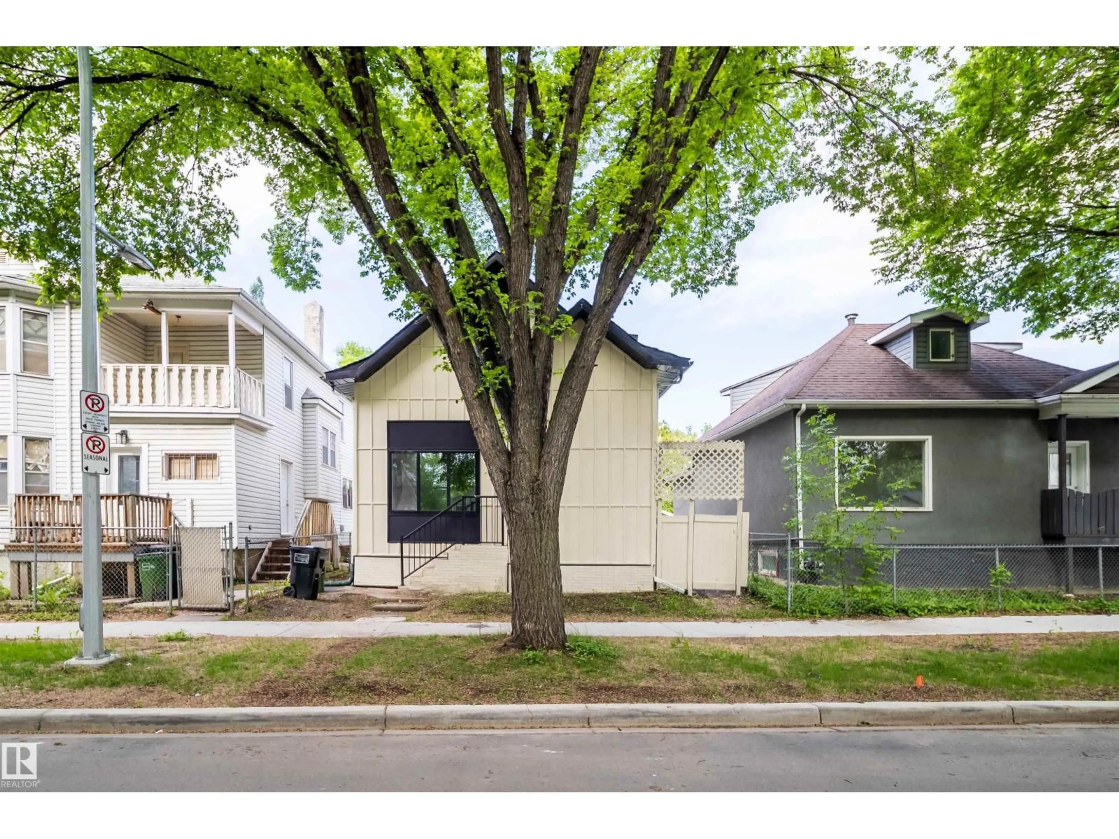 Home with vinyl exterior material, street for NW - 10866 92 ST, Edmonton Alberta T5H1V8