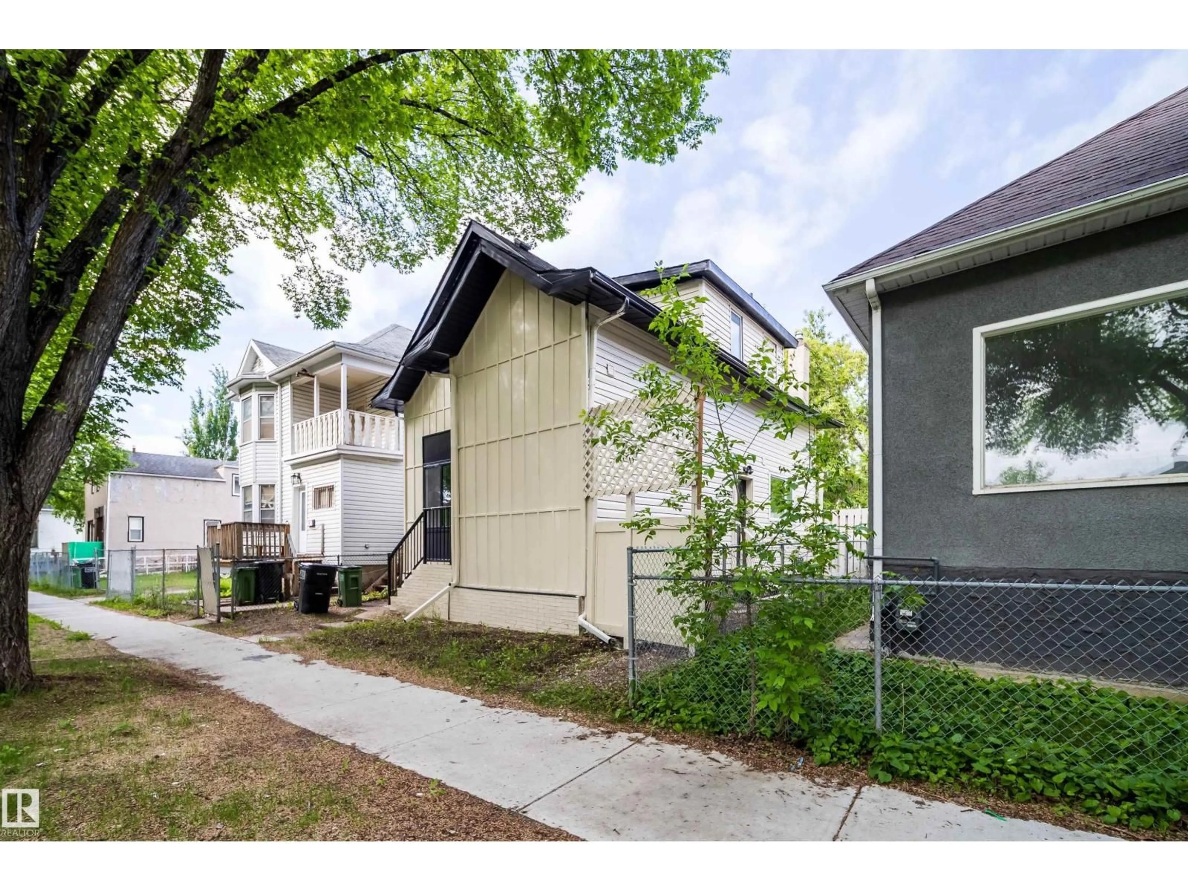 Home with vinyl exterior material, street for NW - 10866 92 ST, Edmonton Alberta T5H1V8