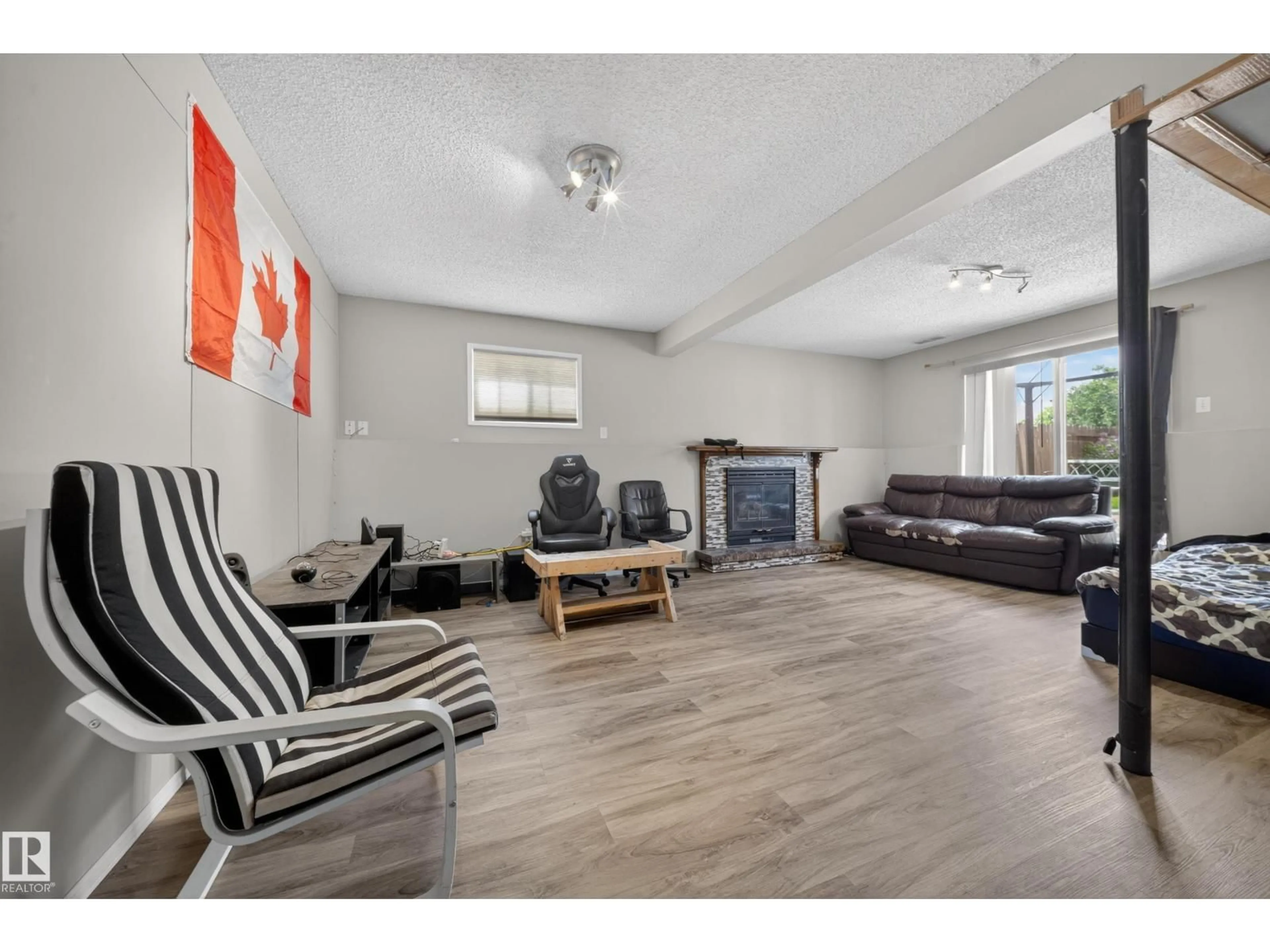 Living room with furniture, wood/laminate floor for 2832 35 ST, Edmonton Alberta T6L3Y4