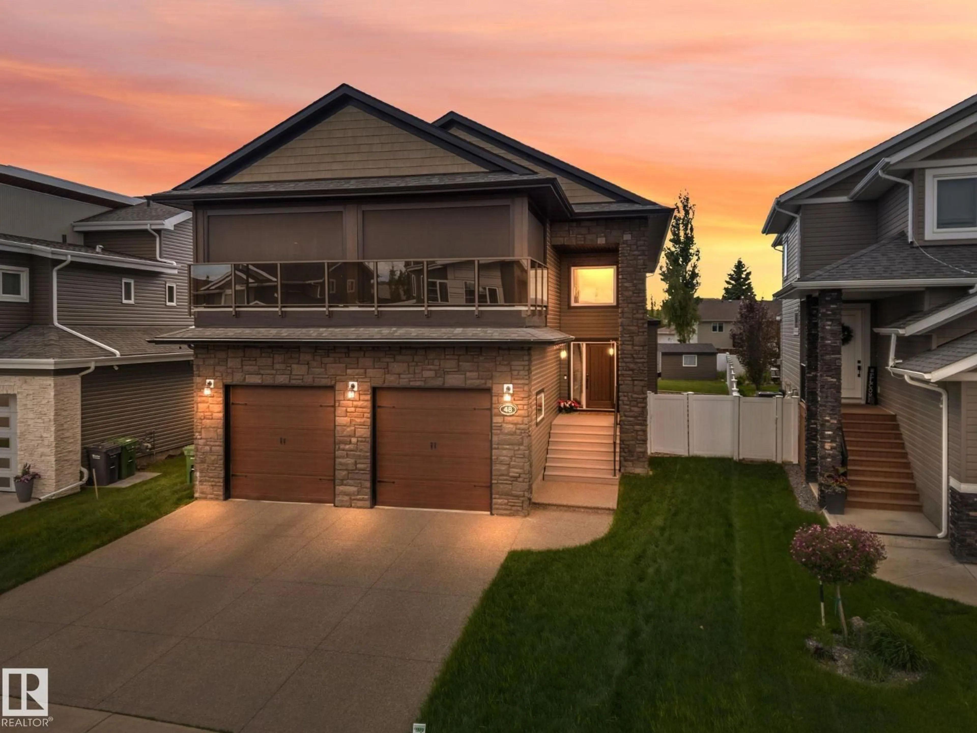 Home with brick exterior material, street for 48 LUNDBERG CR, Red Deer Alberta T4R0R2
