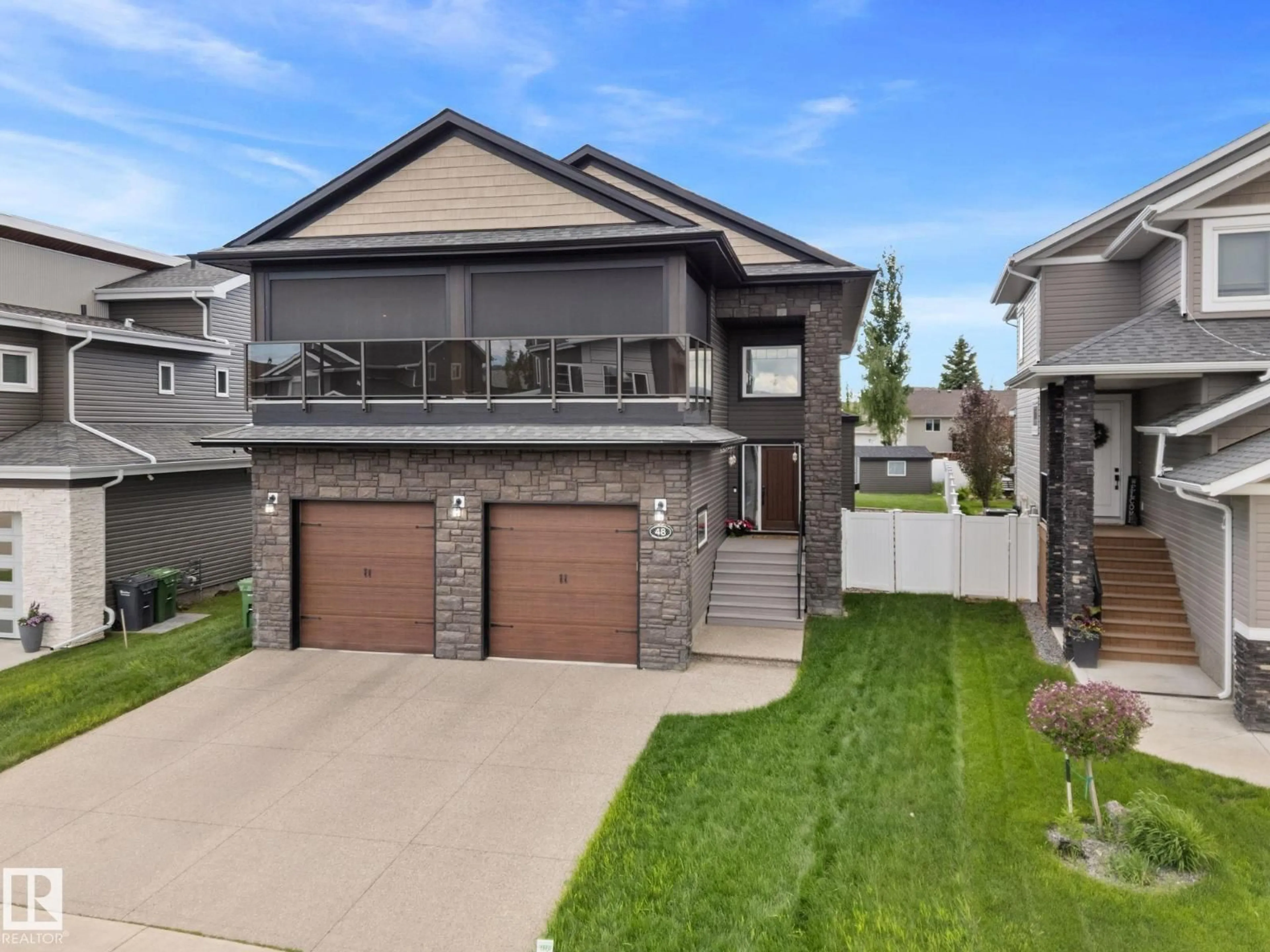 Home with brick exterior material, street for 48 LUNDBERG CR, Red Deer Alberta T4R0R2