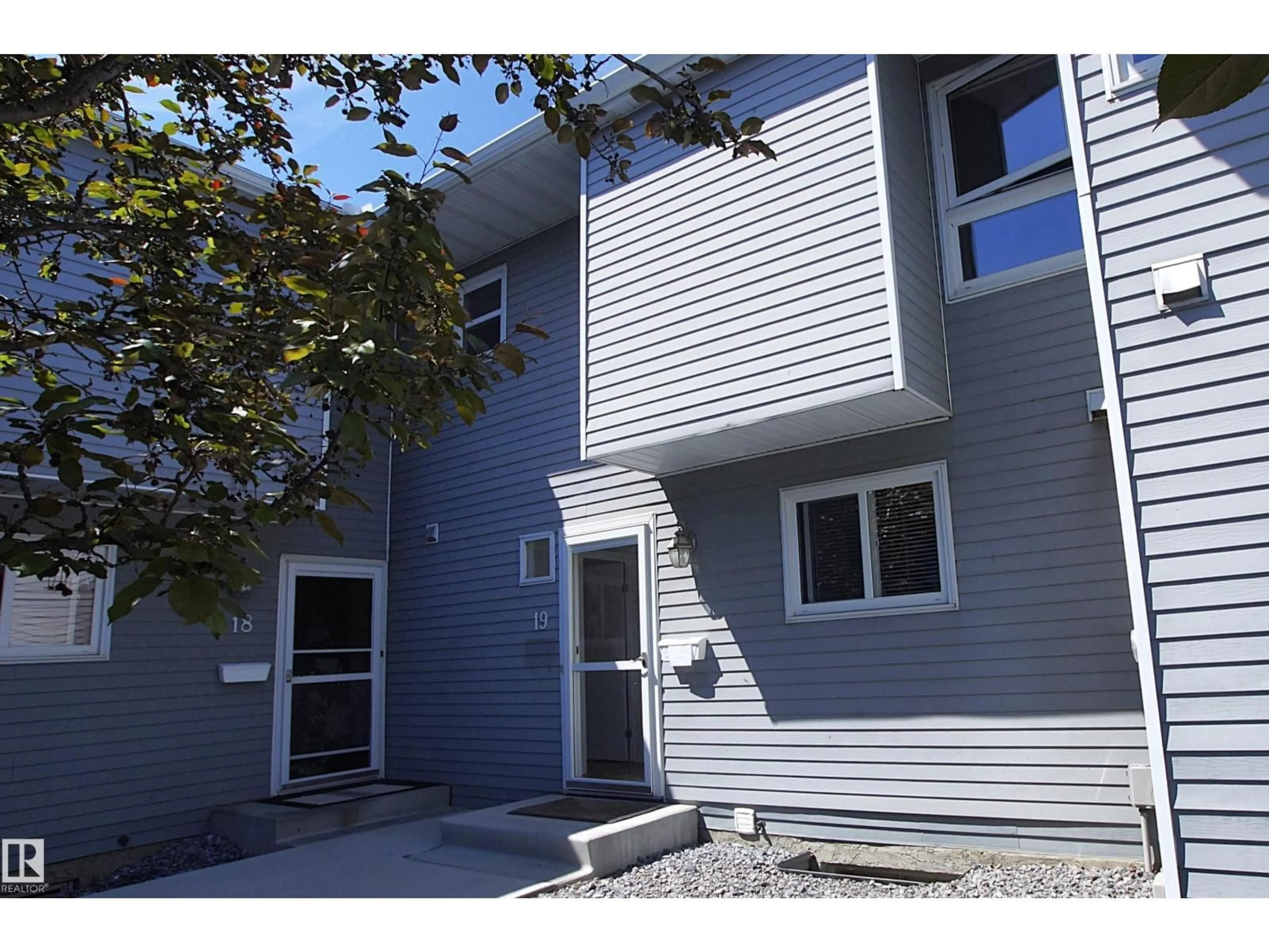 Home with vinyl exterior material, street for 15710 - 19 BEAUMARIS RD, Edmonton Alberta T5X5E2